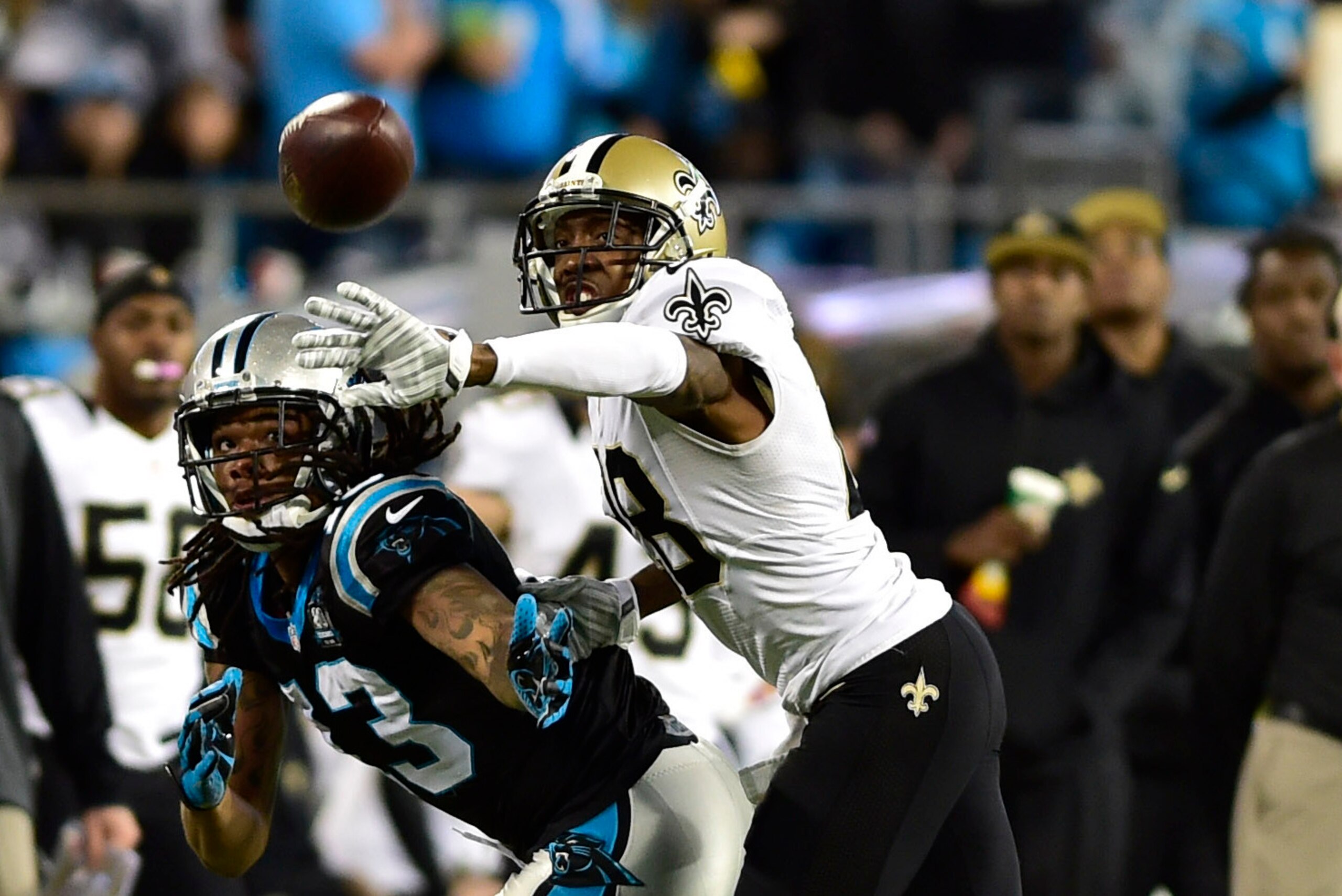 Oct 30, 2014; Charlotte, NC, USA; Carolina Panthers wide receiver Kelvin Benjamin (13) attempts to catch the ball as New Orleans Saints cornerback Keenan Lewis (28) defends in the second quarter at Bank of America Stadium. Mandatory Credit: Bob Donnan-USA