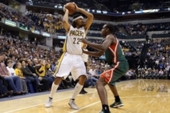 Nov 4, 2014; Indianapolis, IN, USA; Indiana Pacers forward Chris Copeland (22) is guarded by Milwaukee Bucks forward Khris Middleton (22) at Bankers Life Fieldhouse. Milwaukee defeats Indiana 87-81. Mandatory Credit: Brian Spurlock-USA TODAY Sports