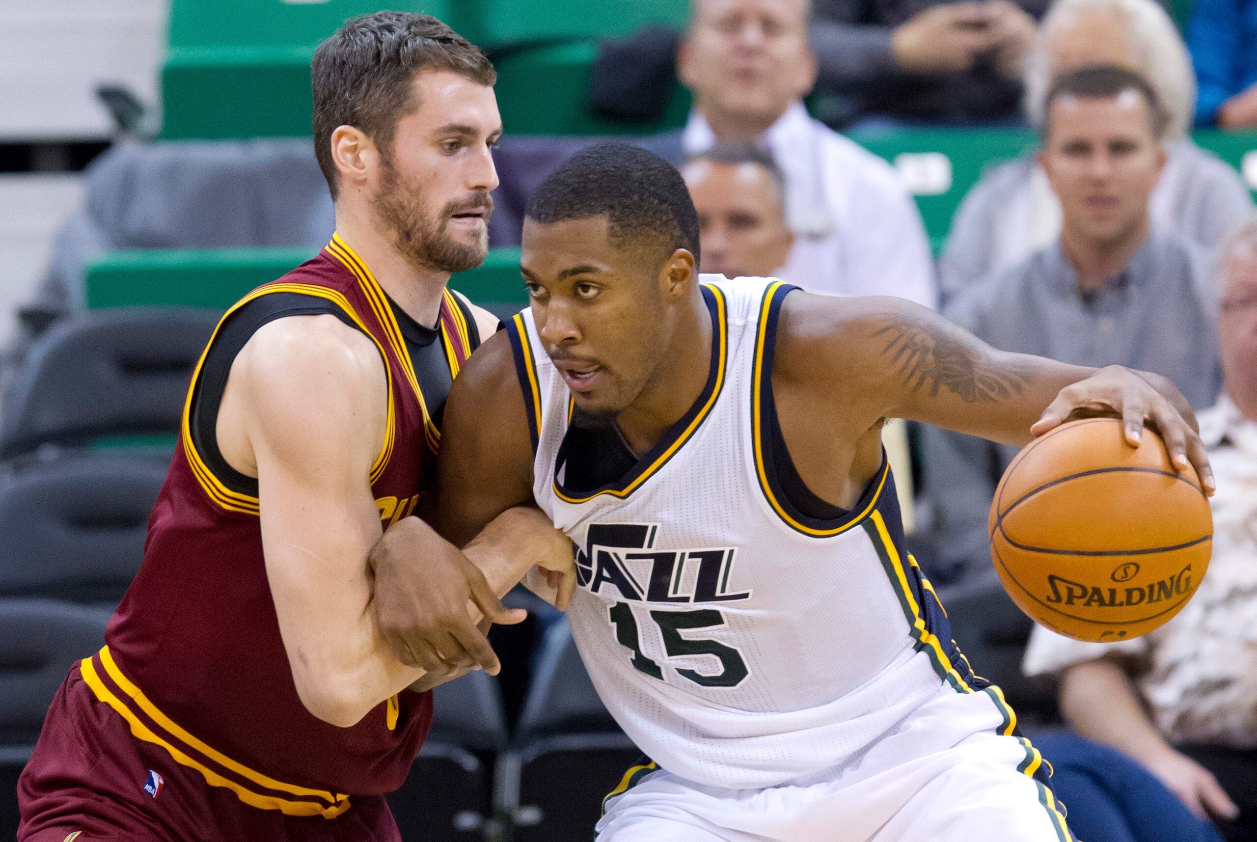 Nov 5, 2014; Salt Lake City, UT, USA; Cleveland Cavaliers forward Kevin Love (0) defends against Utah Jazz center Derrick Favors (15) during the second half at EnergySolutions Arena. The Jazz won 102-100. Mandatory Credit: Russ Isabella-USA TODAY Sports