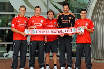 LIVERPOOL, UNITED KINGDOM - AUGUST 03:  Manager Kenny Dalglish (C) presents new signings (L-R) Jordan Henderson, Charlie Adam, Alexander Doni and Stewart Downing of Liverpool following a press conference at Melwood Training Ground on August 3, 2011 in Liv