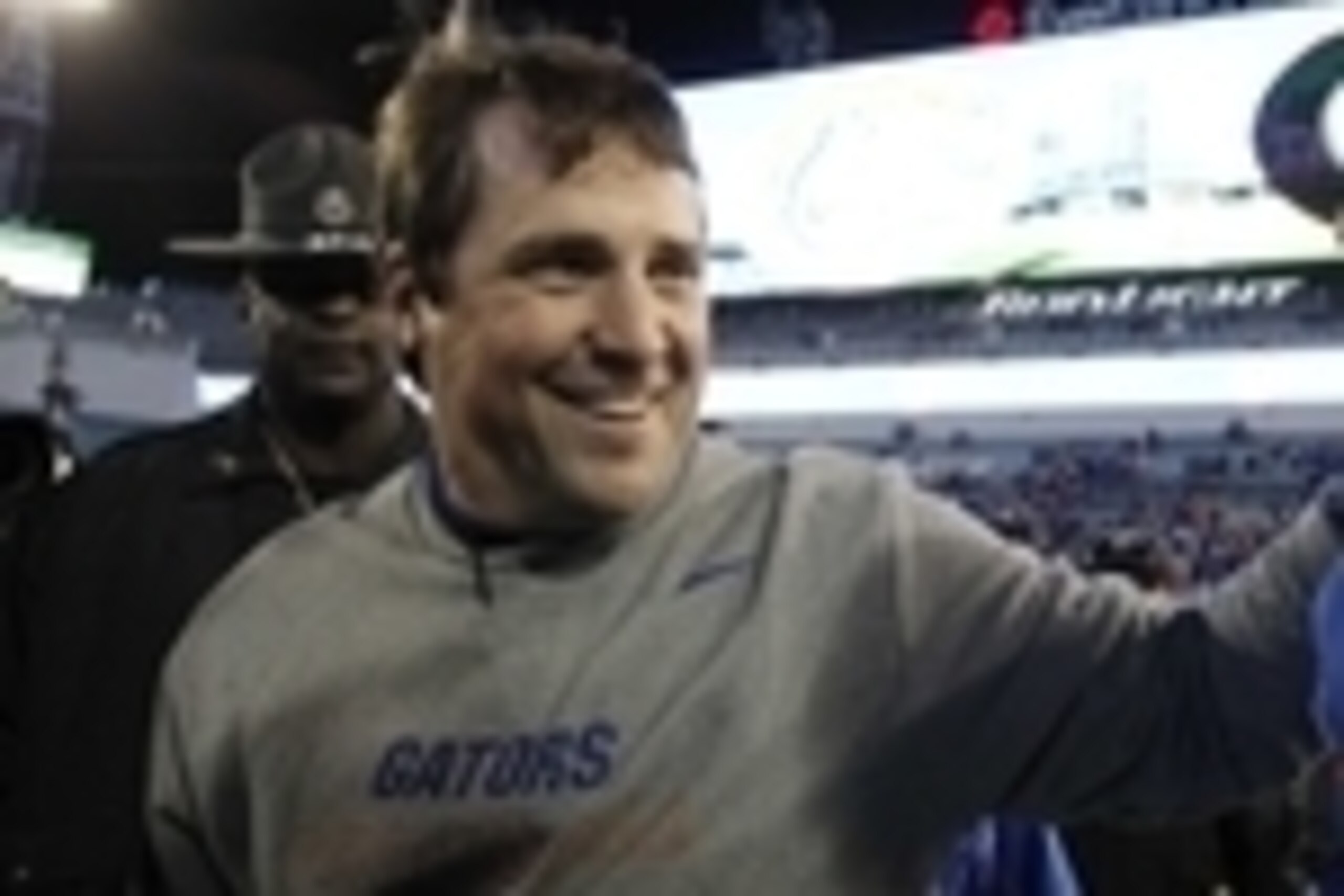 Nov 1, 2014; Jacksonville, FL, USA; Florida Gators head coach Will Muschamp hugs Florida Gators quarterback Treon Harris (3) after they beat the Georgia Bulldogs at EverBank Field. Florida Gators defeated the Georgia Bulldogs 38-20. Mandatory Credit: Kim 