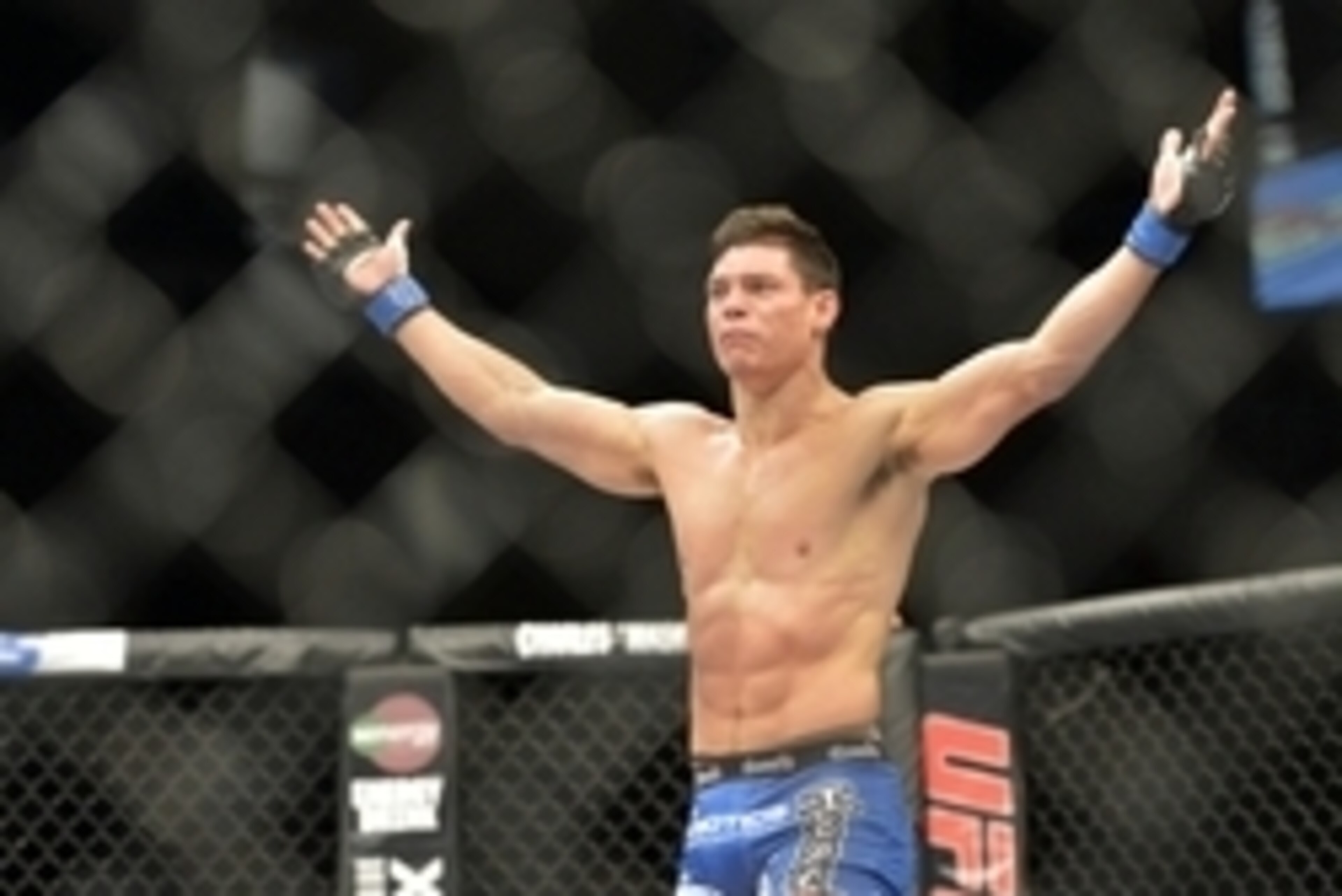 Aug 16, 2014; Bangor, ME, USA;Alan Jouban (blue gloves) celebrates his victory over Seth Baczynski (not pictured) during a welterweight bout in UFC Fight Night 47 at Cross Insurance Center. Mandatory Credit: Gregory J. Fisher-USA TODAY Sports Aug 16, 2014; Bangor, ME, USA;Alan Jouban (blue gloves) celebrates his victory over Seth Baczynski (not pictured) during a welterweight bout in UFC Fight Night 47 at Cross Insurance Center. Mandatory Credit: Gregory J. Fisher-USA TODAY Sports