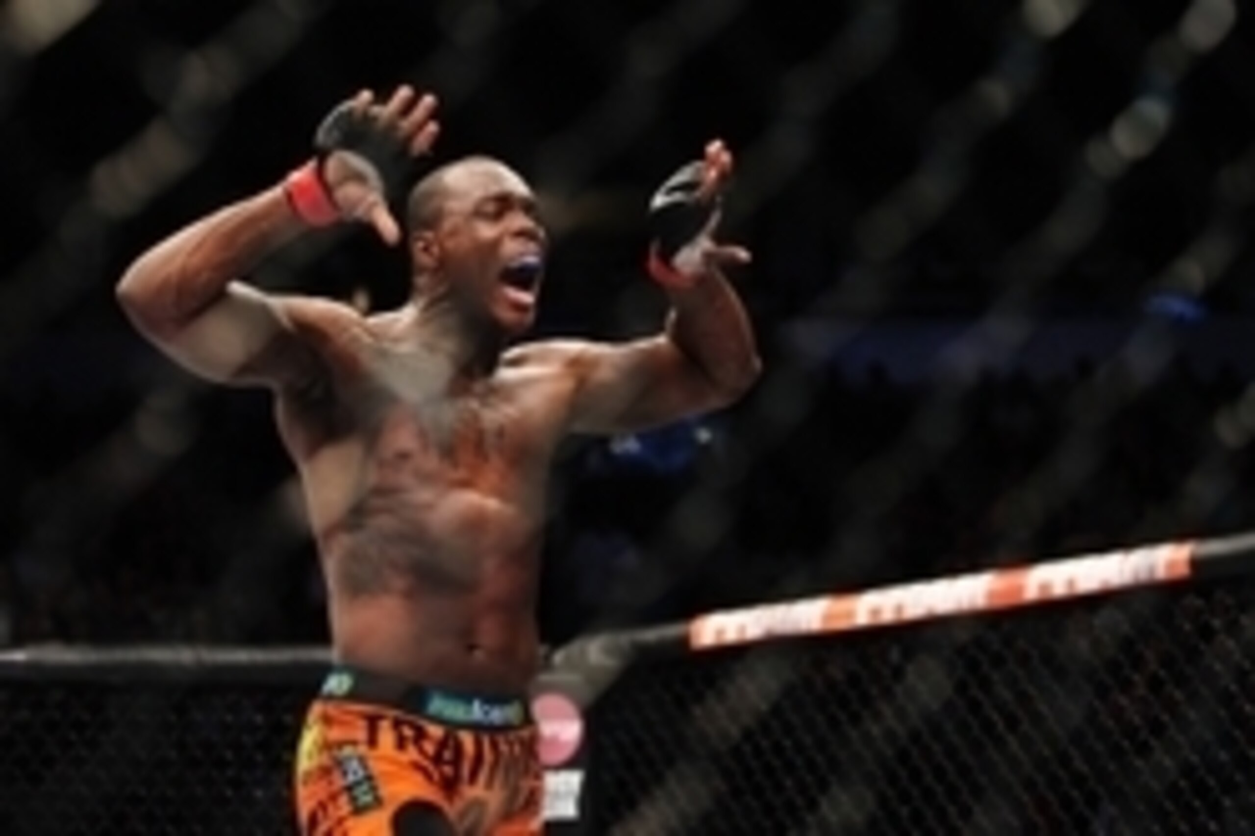 Jun 14, 2014; Vancouver, British Columbia, Canada; Ovince Saint Preux (red) fights Ryan Jimmo (blue) in the light heavyweight bout at UFC 174 at Rogers Arena. Ovince Saint Preux defeats Ryan Jimmo via submission at 2:10 of round 2. Mandatory Credit: Anne-