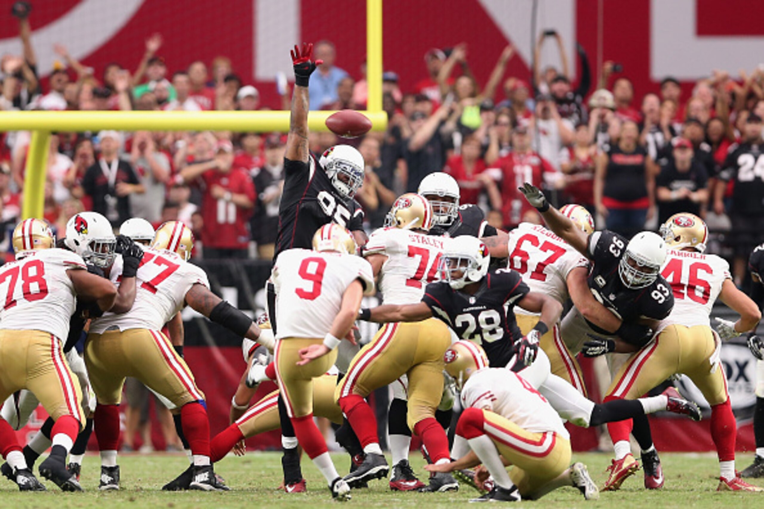 GLENDALE, AZ - SEPTEMBER 21:  Defensive end Tommy Kelly #95 of the Arizona Cardinals blocks a field goal attempt by kicker Phil Dawson #9 of the San Francisco 49ers during the fourth quarter of the NFL game at the University of Phoenix Stadium on Septembe