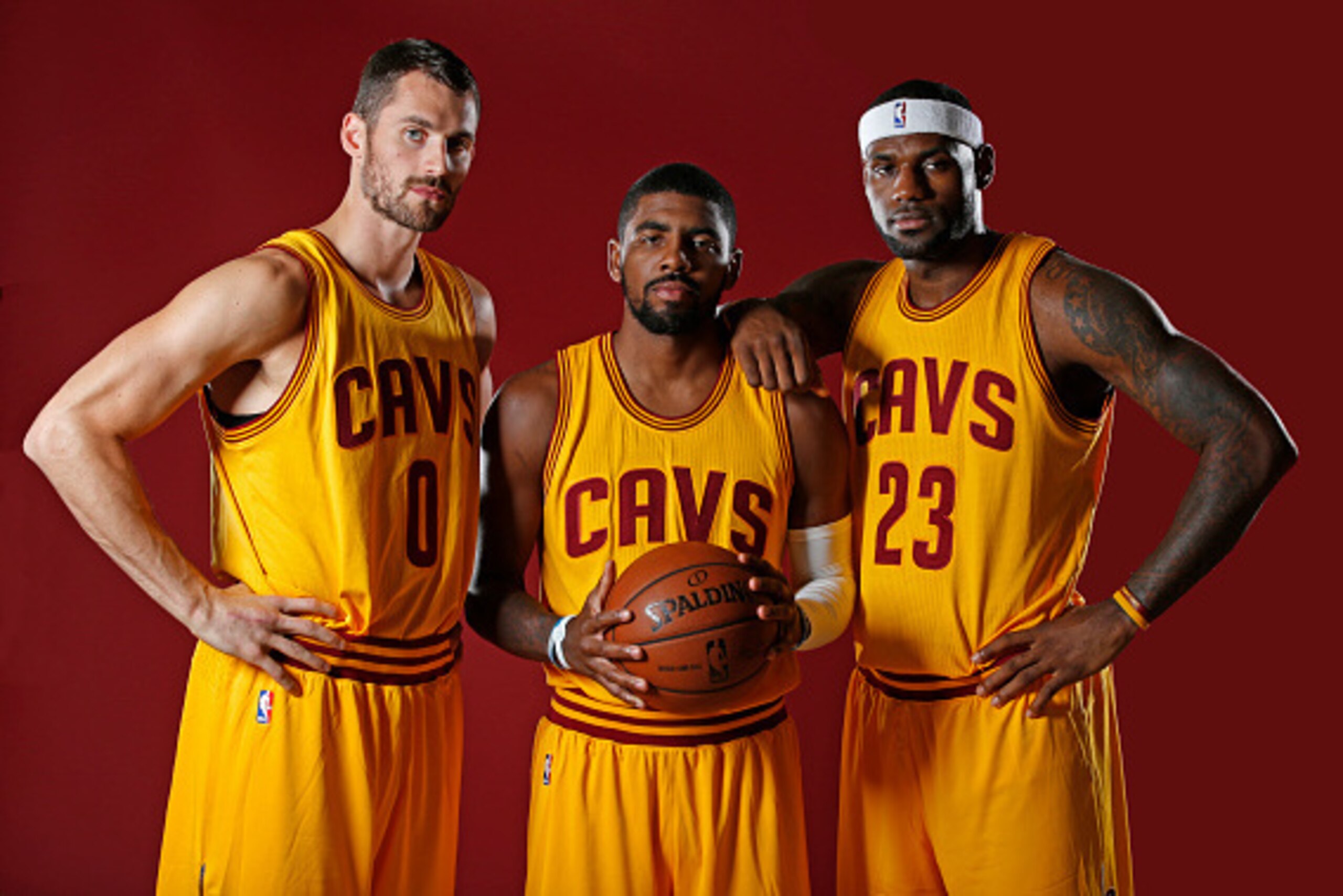INDEPENDENCE, OH - SEPTEMBER 26:  Kevin Love #0, Kyrie Irving #2 and LeBron James #23 of the Cleveland Cavaliers poses for a photo during media day on September 26, 2014 at the Cleveland Clinic Courts in Independence, Ohio.  NOTE TO USER: User expressly a