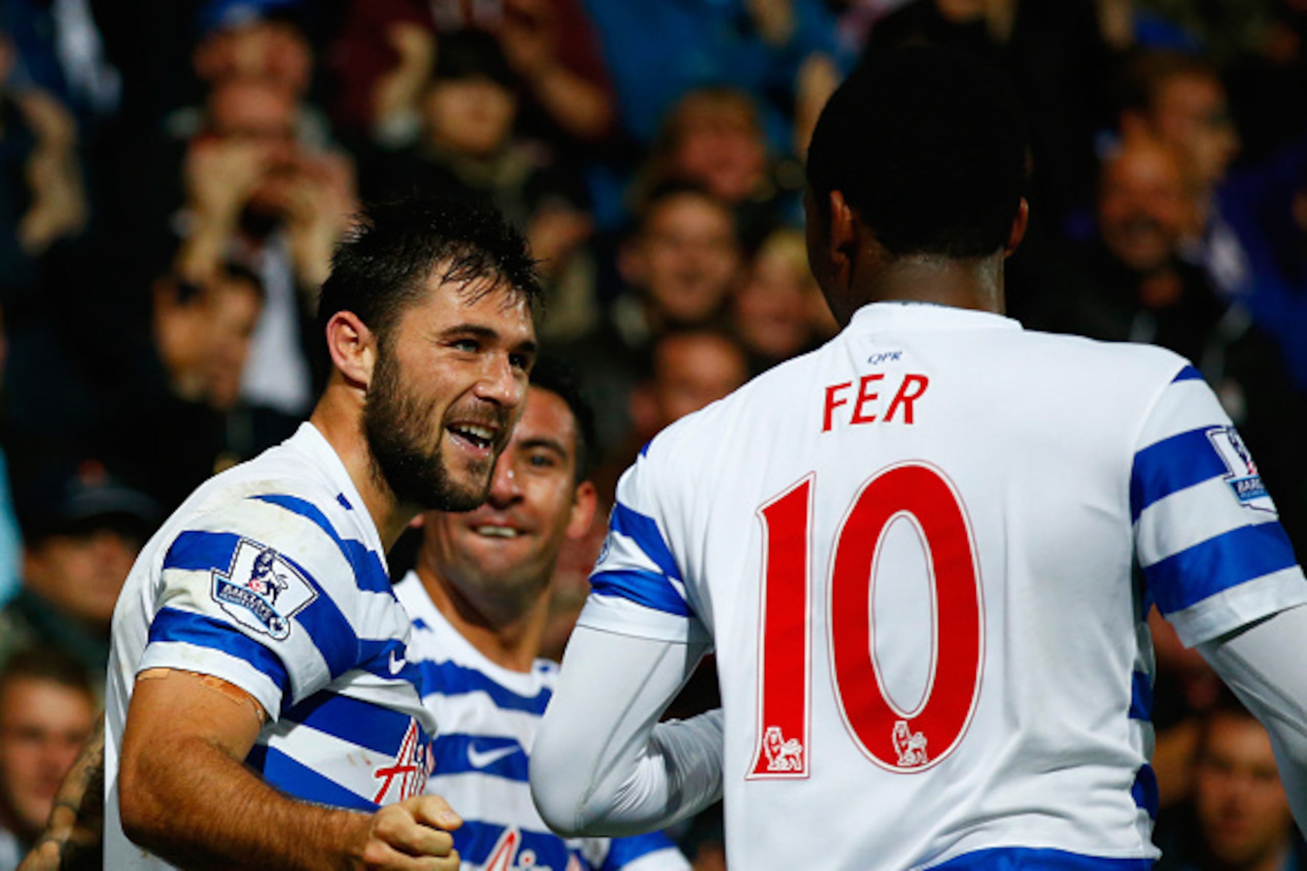 LONDON, ENGLAND - OCTOBER 27:  Charlie Austin of QPR celebrates scoring their second goal with Leroy Fer of QPR during the Barclays Premier League match between Queens Park Rangers and Aston Villa at Loftus Road on October 27, 2014 in London, England.  (P