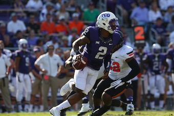 FORT WORTH, TX - OCTOBER 18:  Trevone Boykin #2 of the TCU Horned Frogs throws against the Oklahoma State Cowboys at Amon G. Carter Stadium on October 18, 2014 in Fort Worth, Texas.  (Photo by Ronald Martinez/Getty Images)