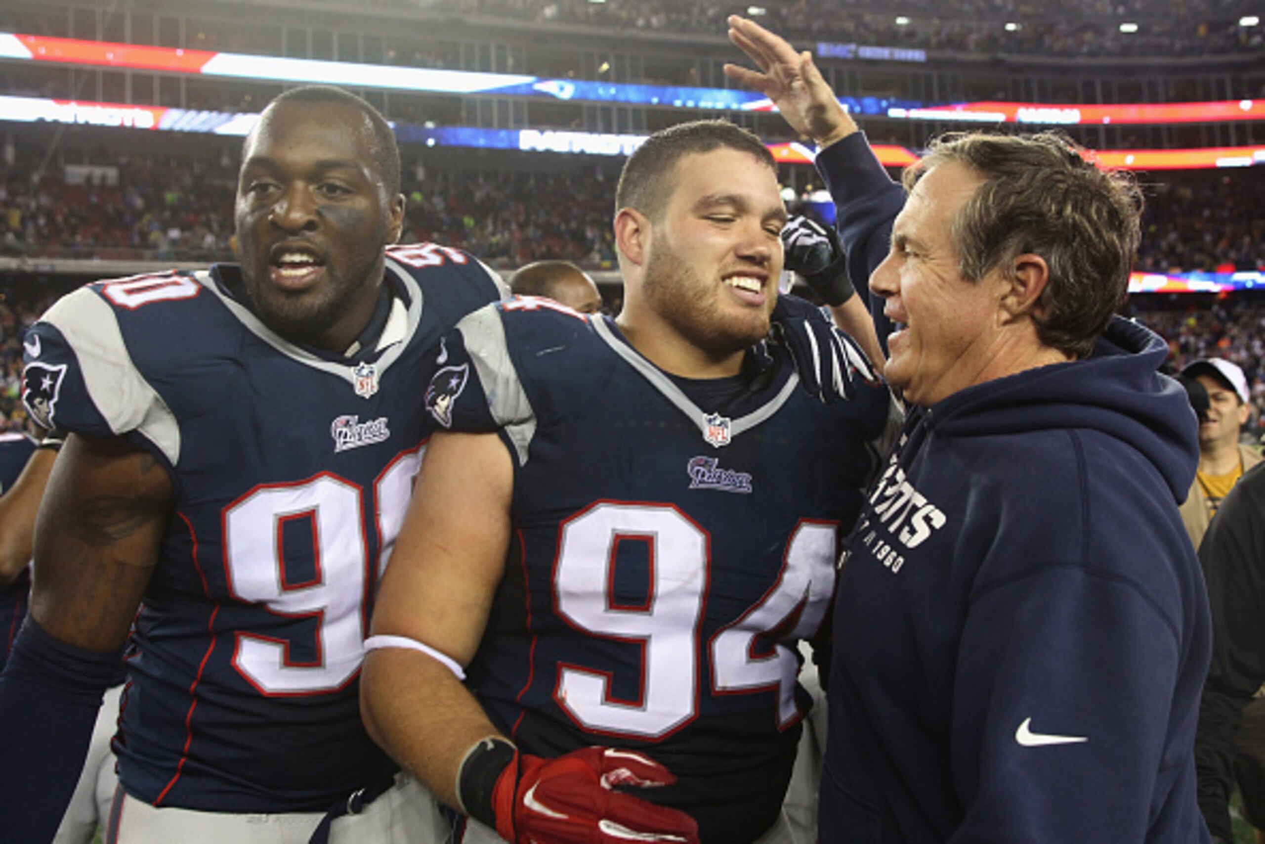 FOXBORO, MA - OCTOBER 16:  Chris Jones #94 of the New England Patriots is congratulated by head coach Bill Belichick after blocking a field goal attempt in the final seconds of the fourth quarter against the New York Jets Gillette Stadium on October 16, 2