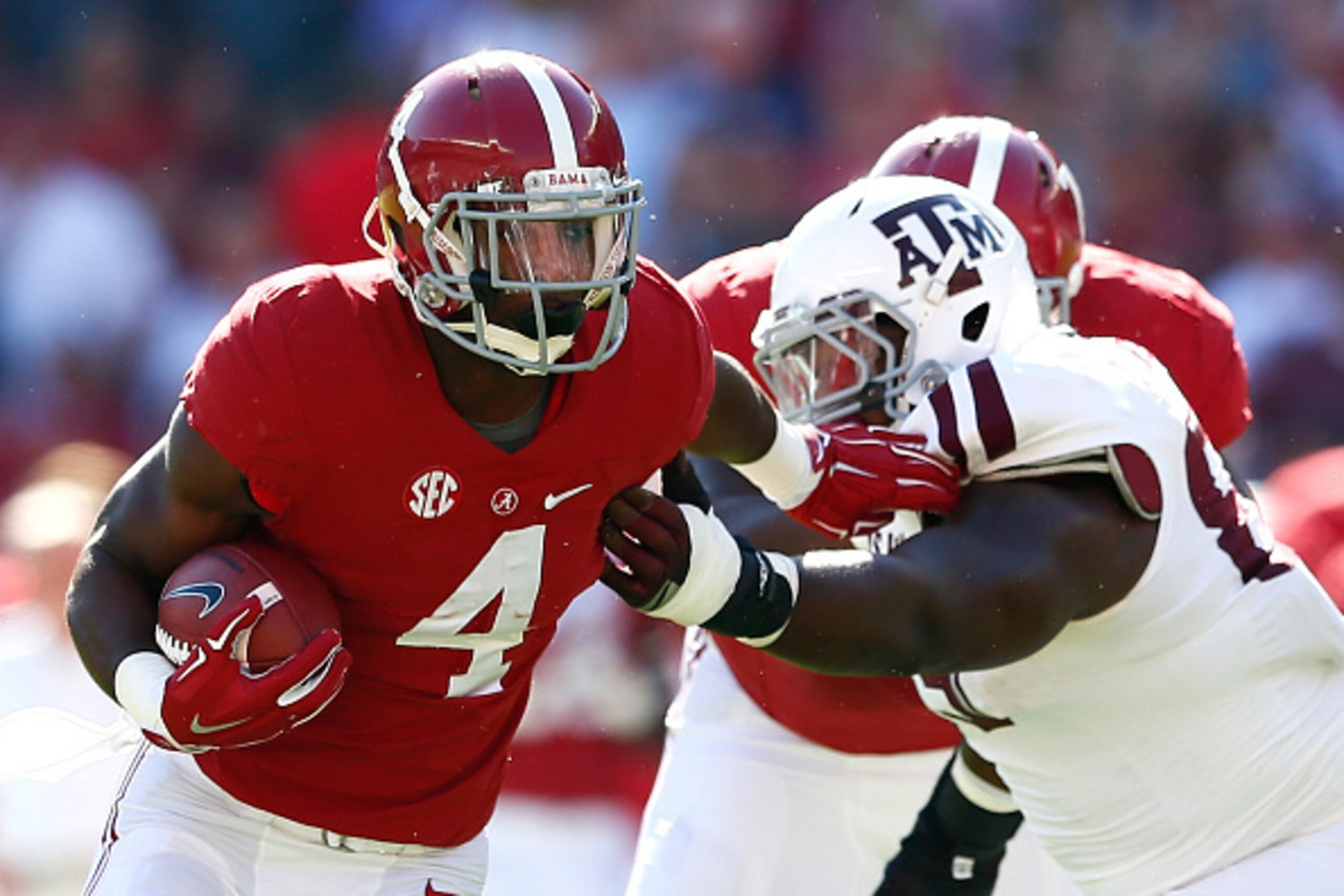 TUSCALOOSA, AL - OCTOBER 18:  T.J. Yeldon #4 of the Alabama Crimson Tide breaks a tackle by Ivan Robinson #89 of the Texas A&M Aggies at Bryant-Denny Stadium on October 18, 2014 in Tuscaloosa, Alabama.  (Photo by Kevin C. Cox/Getty Images)