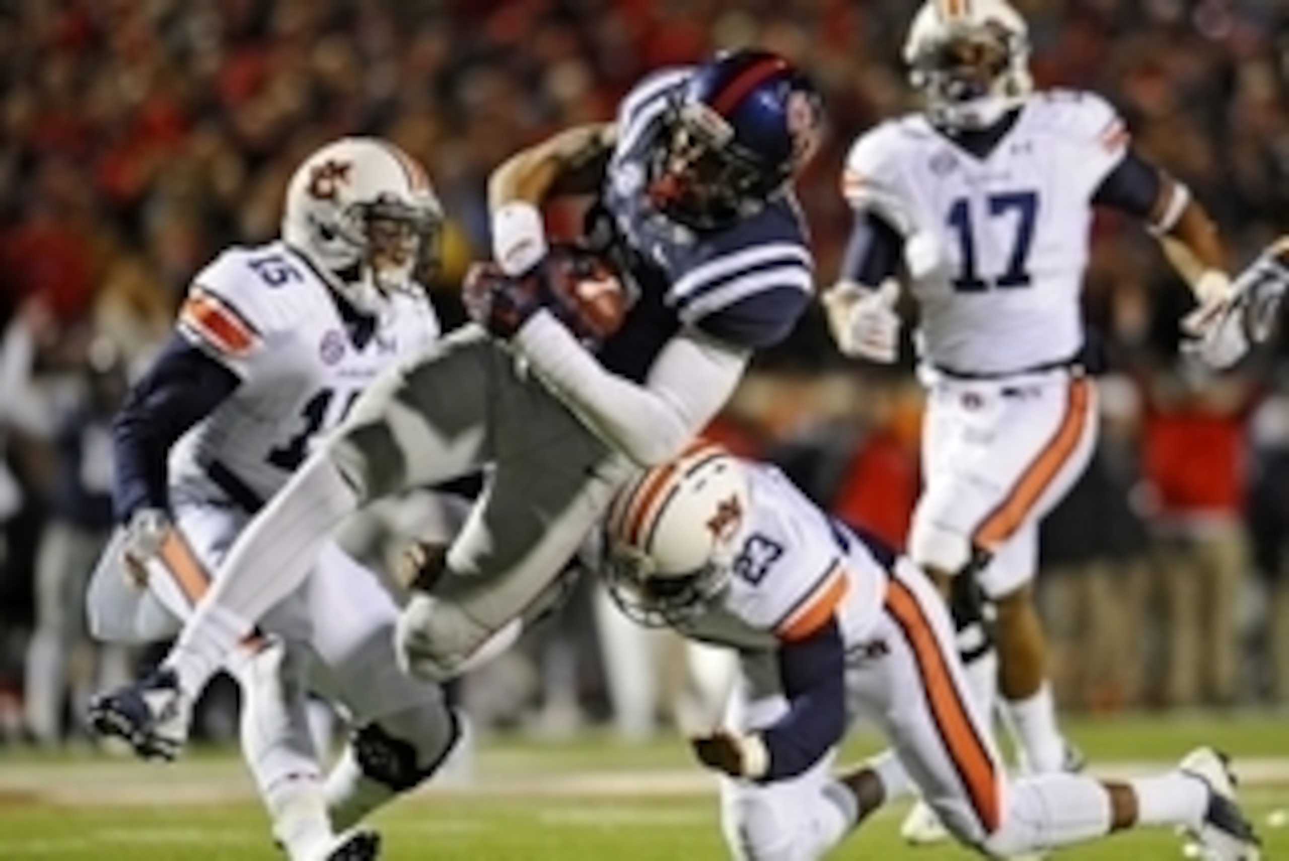 Nov 1, 2014; Oxford, MS, USA; Ole Miss Rebels tight end Evan Engram (17) is tackled by Auburn Tigers defensive back Johnathan Ford (23) during the second half at Vaught-Hemingway Stadium. Auburn won 35-31. Mandatory Credit: Shanna Lockwood-USA TODAY Sport Nov 1, 2014; Oxford, MS, USA; Ole Miss Rebels tight end Evan Engram (17) is tackled by Auburn Tigers defensive back Johnathan Ford (23) during the second half at Vaught-Hemingway Stadium. Auburn won 35-31. Mandatory Credit: Shanna Lockwood-USA TODAY Sport