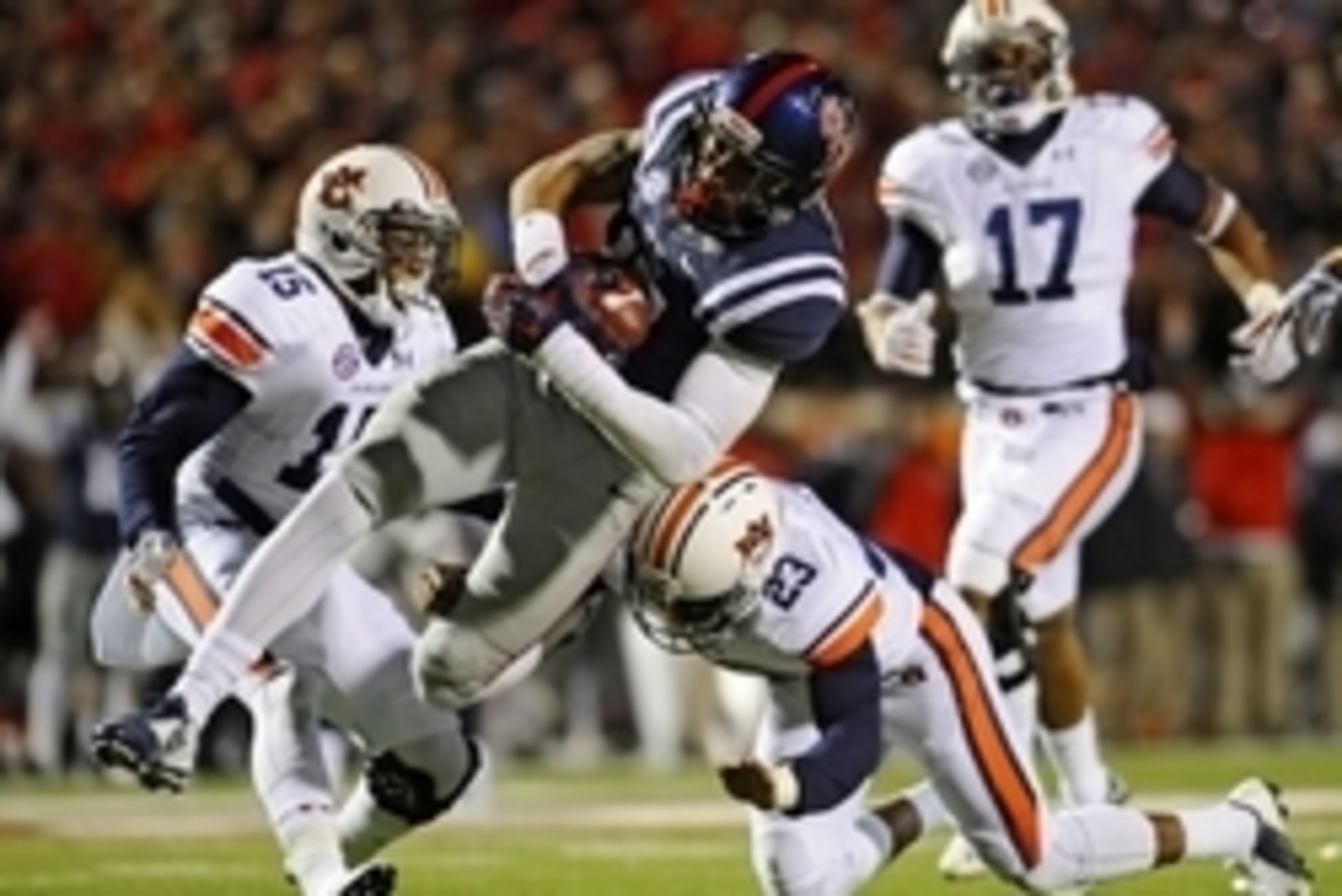 Nov 1, 2014; Oxford, MS, USA; Ole Miss Rebels tight end Evan Engram (17) is tackled by Auburn Tigers defensive back Johnathan Ford (23) during the second half at Vaught-Hemingway Stadium. Auburn won 35-31. Mandatory Credit: Shanna Lockwood-USA TODAY Sport