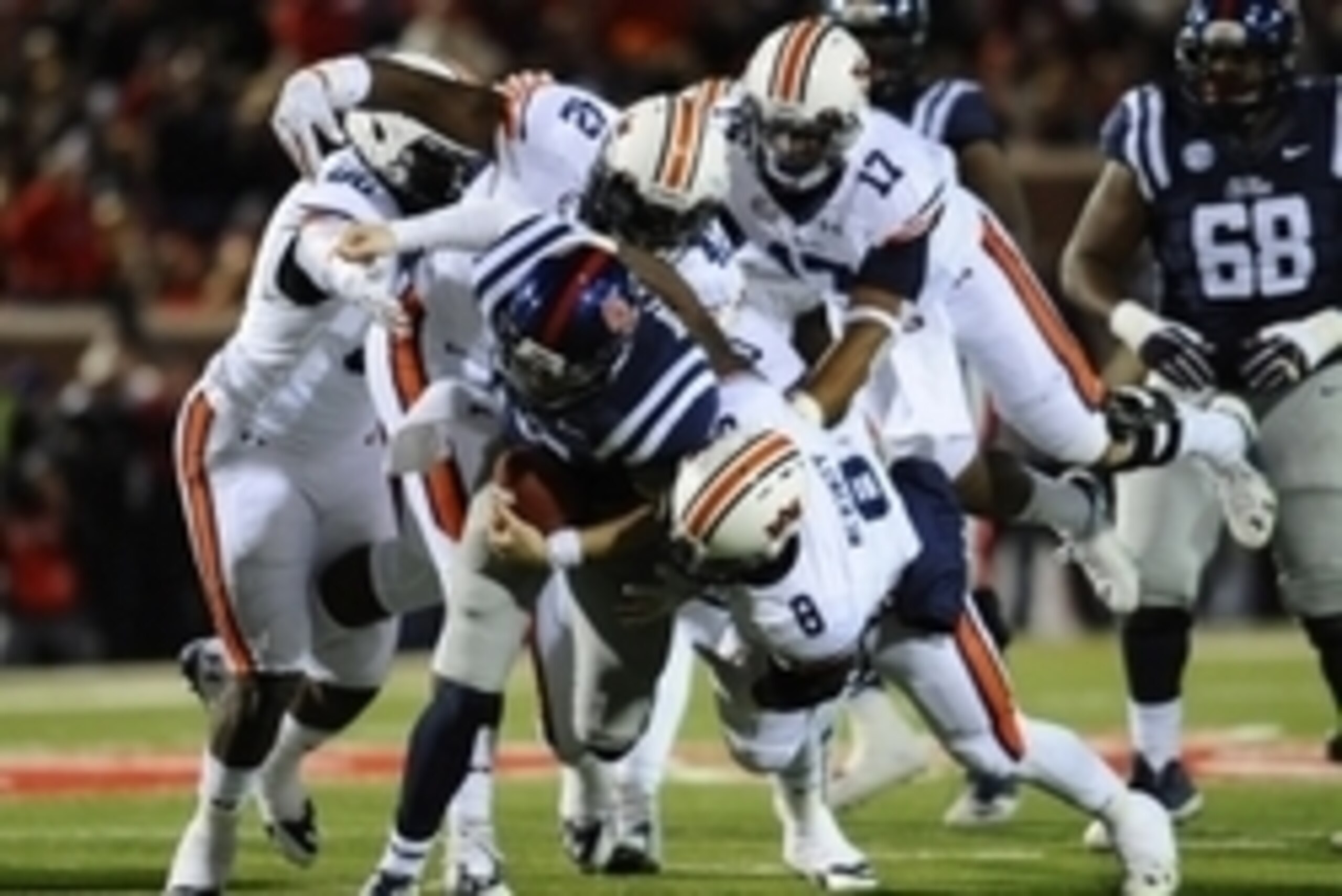 Nov 1, 2014; Oxford, MS, USA; Ole Miss Rebels quarterback Bo Wallace (14) is tackled by Auburn Tigers linebacker Cassanova McKinzy (8) during the second quarter at Vaught-Hemingway Stadium. Mandatory Credit: Shanna Lockwood-USA TODAY Sports Nov 1, 2014; Oxford, MS, USA; Ole Miss Rebels quarterback Bo Wallace (14) is tackled by Auburn Tigers linebacker Cassanova McKinzy (8) during the second quarter at Vaught-Hemingway Stadium. Mandatory Credit: Shanna Lockwood-USA TODAY Sports
