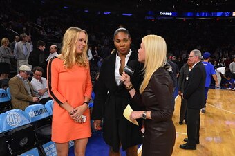 NEW YORK, NY - NOVEMBER 4: Caroline Wozniacki and Serena Williams attend the Washington Wizards Vs New York Knicks game at Madison Square Garden on November 4, 2014 in New York City. NOTE TO USER: User expressly acknowledges and agrees that, by downloadin