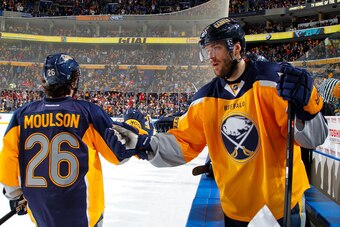 BUFFALO, NY - NOVEMBER 24: Matt Moulson #26 and Ville Leino #23 of the Buffalo Sabres celebrate a goal against the Detroit Red Wings wearing their new third jerseys on November 24, 2013 at the First Niagara Center in Buffalo, New York. (Photo by Bill Wipp