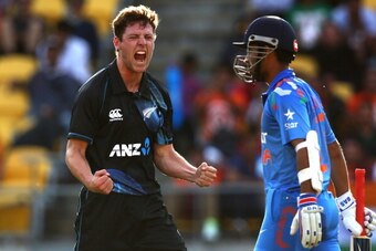 WELLINGTON, NEW ZEALAND - JANUARY 31:  Matt Henry of New Zealand celebrates his wicket of Ajinkya Rahane of India (R) during Game 5 of the men's one day international between New Zealand and India at Westpac Stadium on January 31, 2014 in Wellington, New 