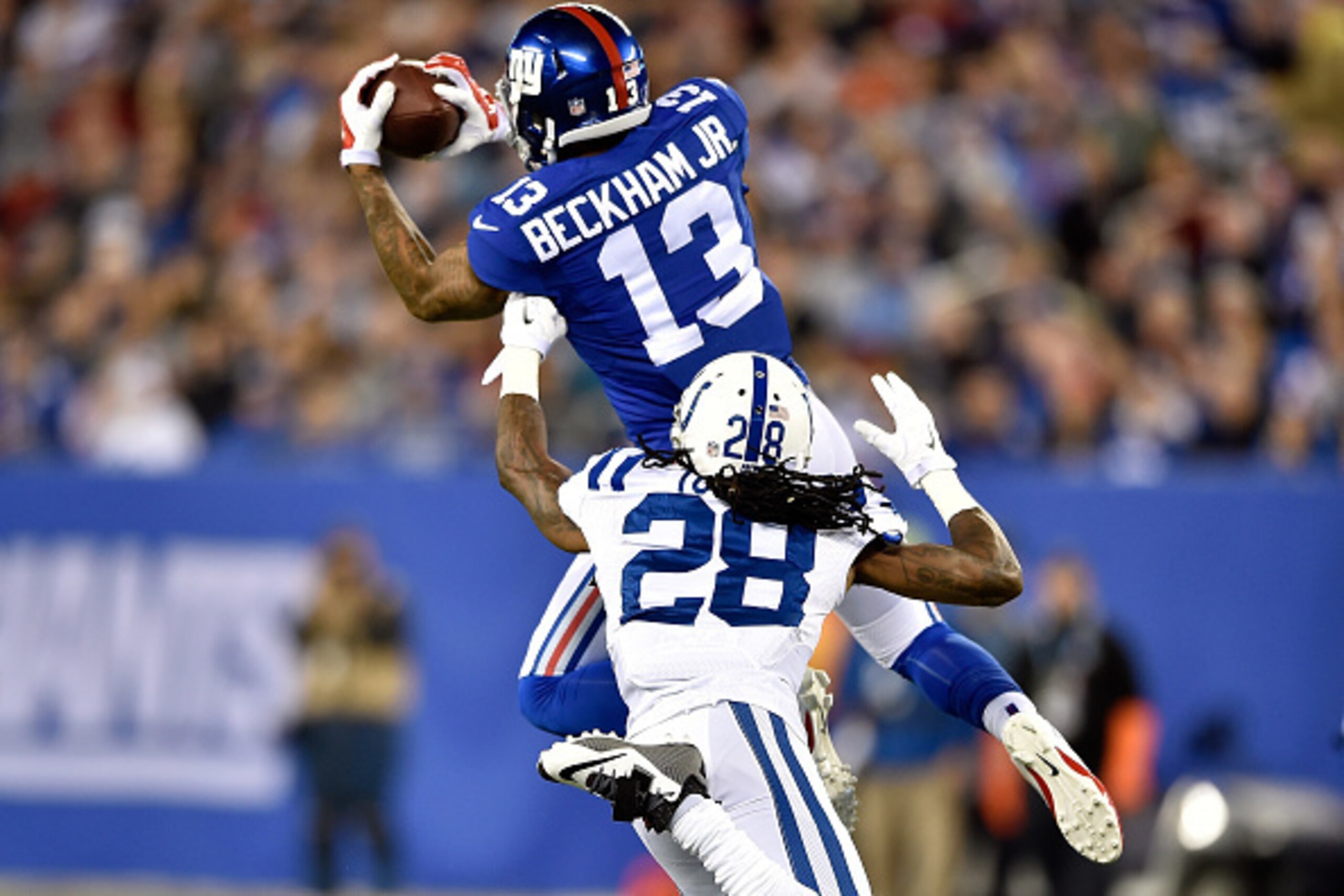 EAST RUTHERFORD, NJ - NOVEMBER 03:   Odell Beckham #13 of the New York Giants catches a pass in the first half against Greg Toler #28 of the Indianapolis Colts during their game at MetLife Stadium on November 3, 2014 in East Rutherford, New Jersey.  (Phot