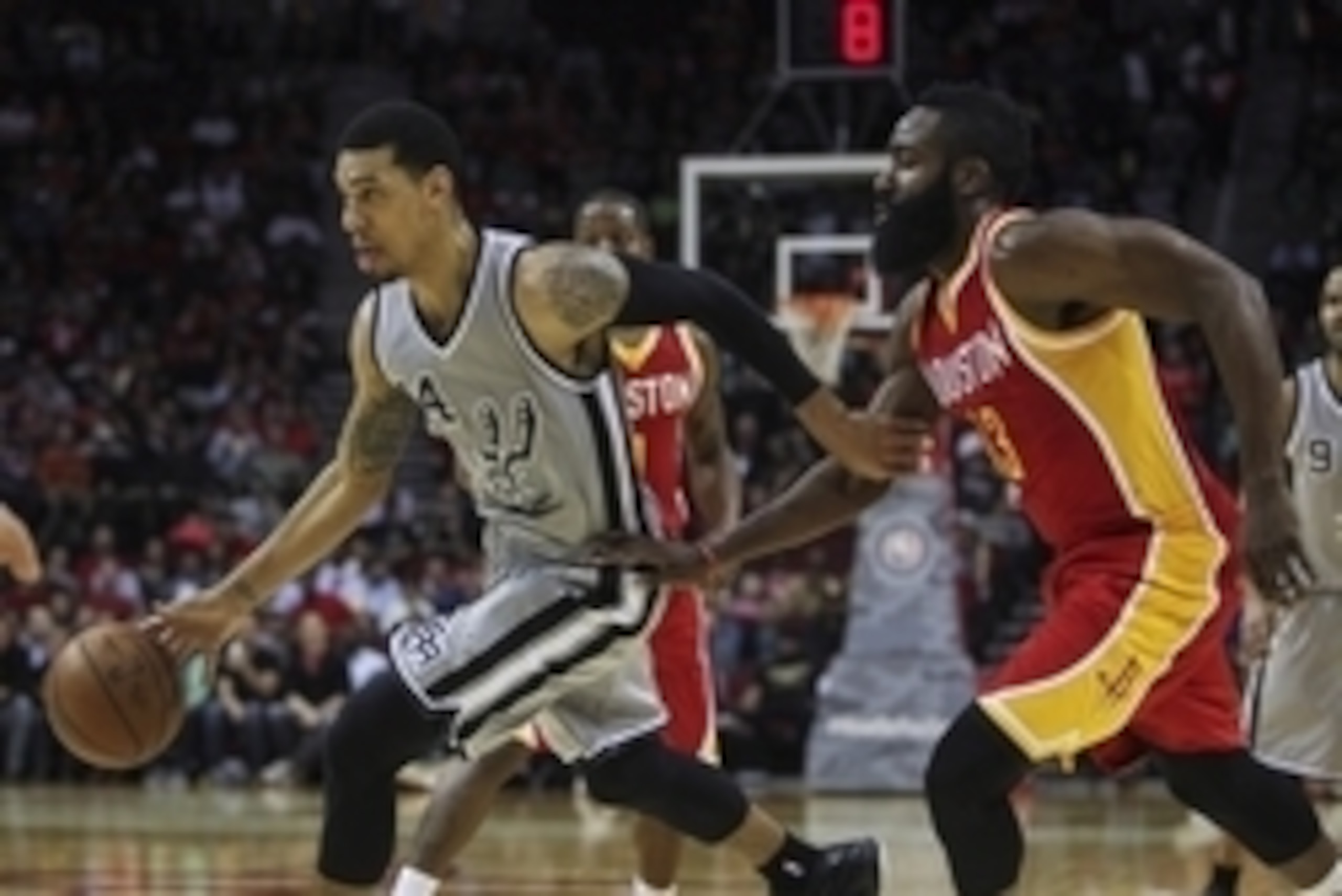 Nov 6, 2014; Houston, TX, USA; San Antonio Spurs guard Danny Green (14) drives the ball during the first quarter as Houston Rockets guard James Harden (13) defends at Toyota Center. Mandatory Credit: Troy Taormina-USA TODAY Sports