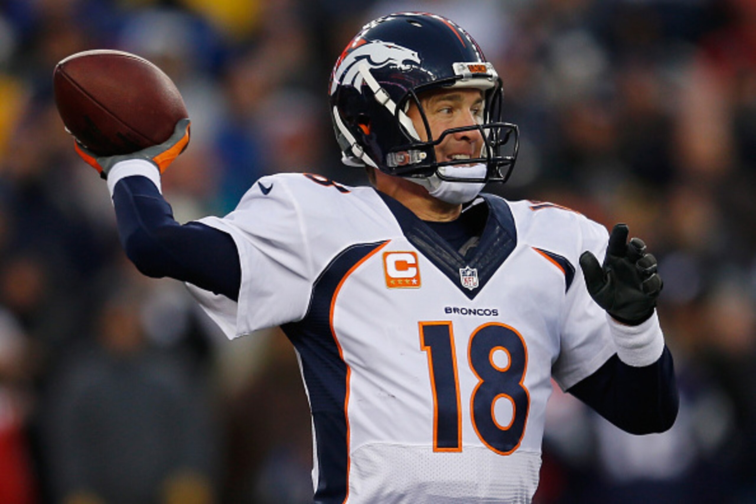 FOXBORO, MA - NOVEMBER 02:  Peyton Manning #18 of the Denver Broncos passes the ball during the first quarter against the New England Patriots at Gillette Stadium on November 2, 2014 in Foxboro, Massachusetts.  (Photo by Jim Rogash/Getty Images)