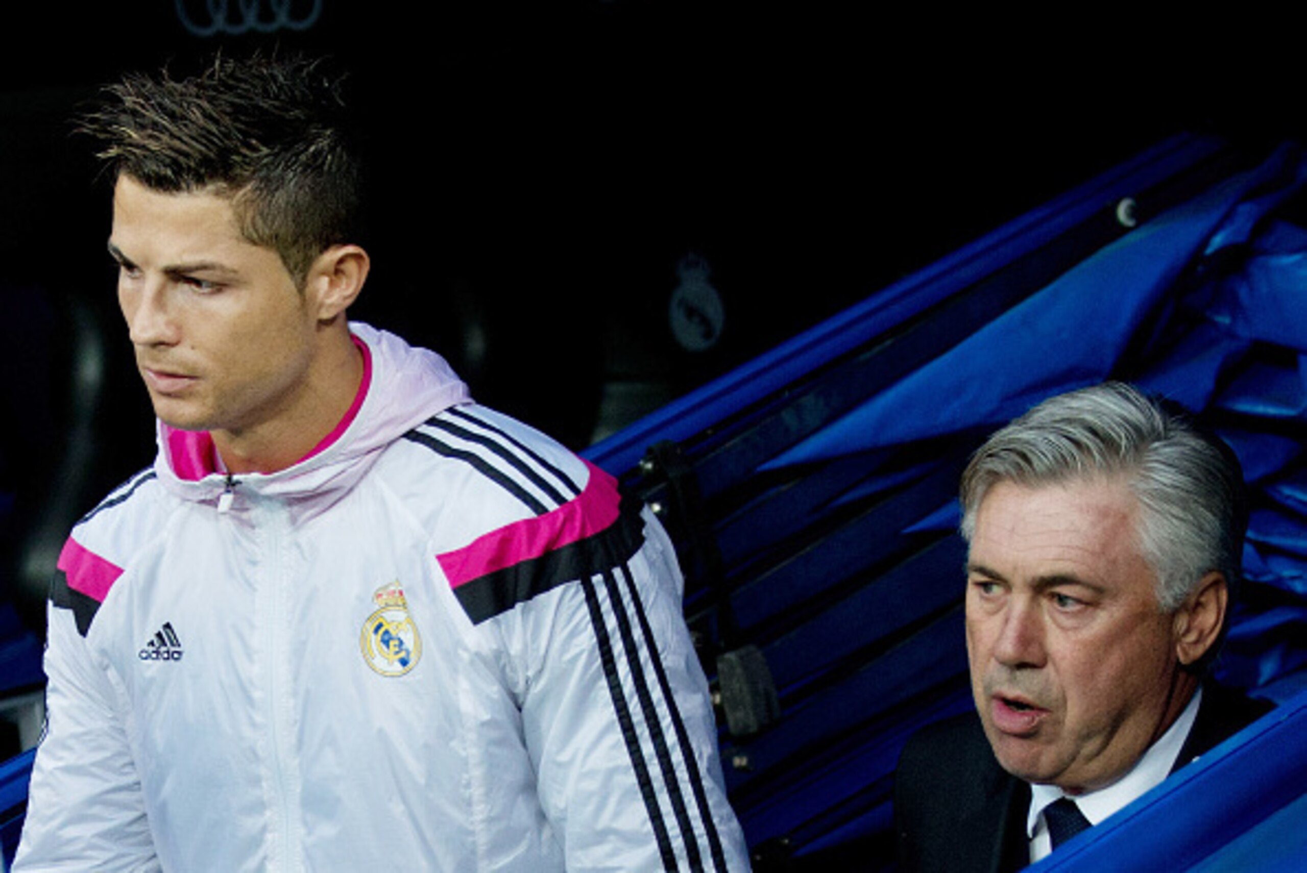 MADRID, SPAIN - SEPTEMBER 23: Cristiano Ronaldo (L) of Real Madrid CF enters the pitch followed by his head coach Carlo Ancelotti (R) prior to start the La Liga match between Real Madrid CF and Elche CF at Estadio Santiago Bernabeu on September 23, 2014 i