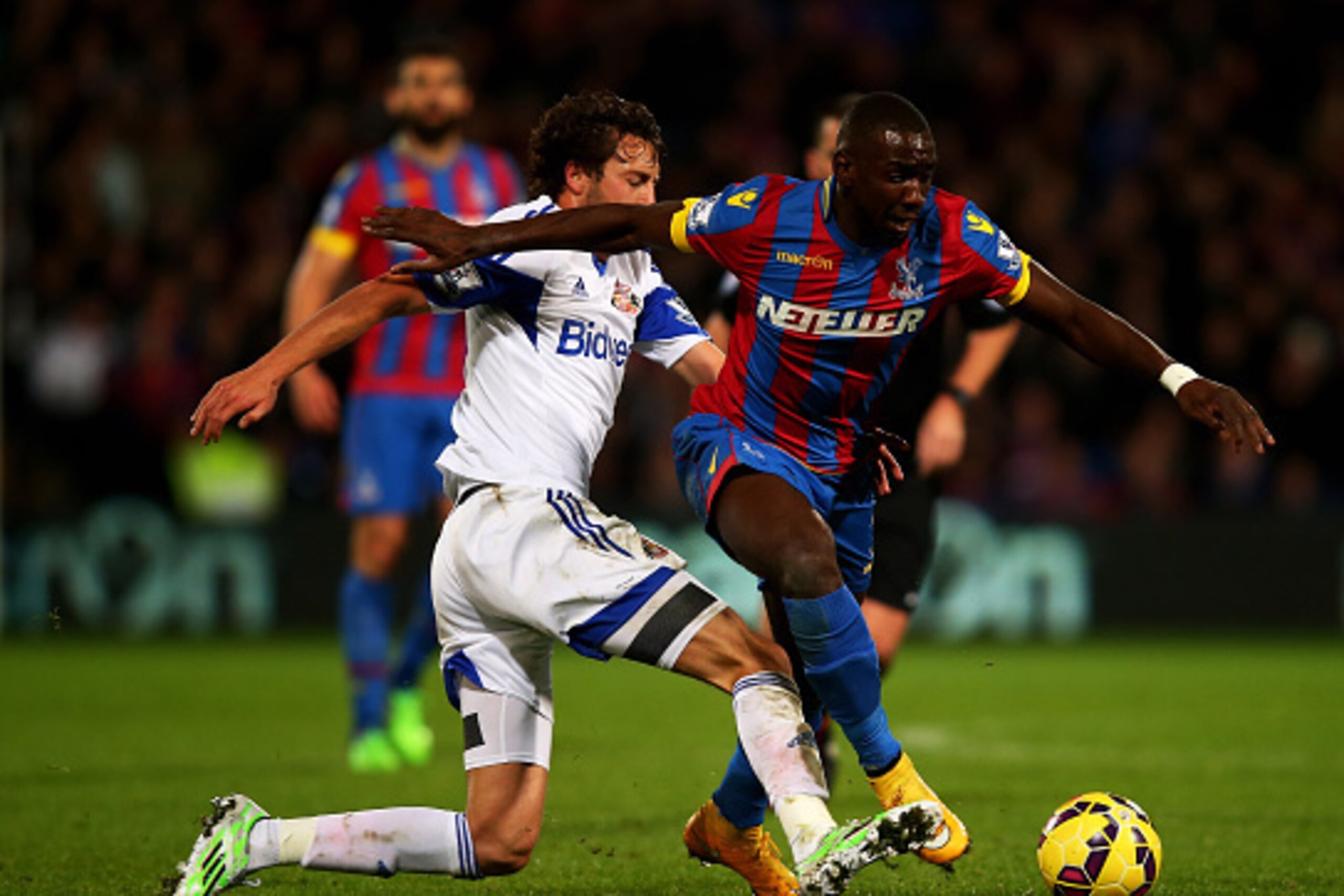 LONDON, ENGLAND - NOVEMBER 03:  Yannick Bolasie of Crystal Palace is tackled by Will Buckley of Sunderland during the Barclays Premier League match between Crystal Palace and Sunderland at Selhurst Park on November 3, 2014 in London, England.  (Photo by C