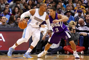 Nov 3, 2014; Denver, CO, USA; Sacramento Kings guard Ray McCallum (3) guards Denver Nuggets guard Randy Foye (4) in the third quarter at the Pepsi Center. The Kings won 110-105. Mandatory Credit: Isaiah J. Downing-USA TODAY Sports