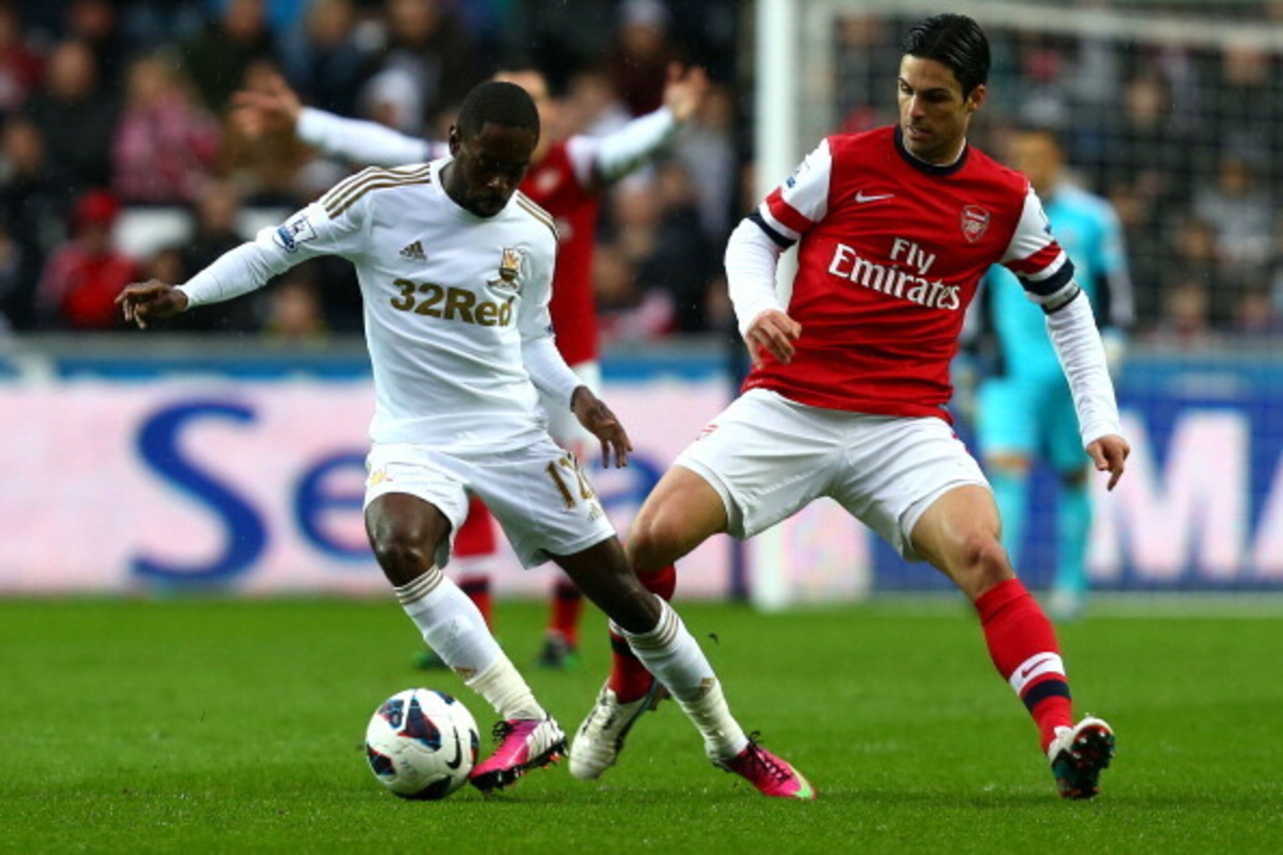 SWANSEA, WALES - MARCH 16:   Nathan Dyer of Swansea City shields the ball from Mikel Arteta of Arsenal during the Barclays Premier League match between Swansea City and Arsenal at Liberty Stadium on March 16, 2013 in Swansea, Wales.  (Photo by Jan Kruger/