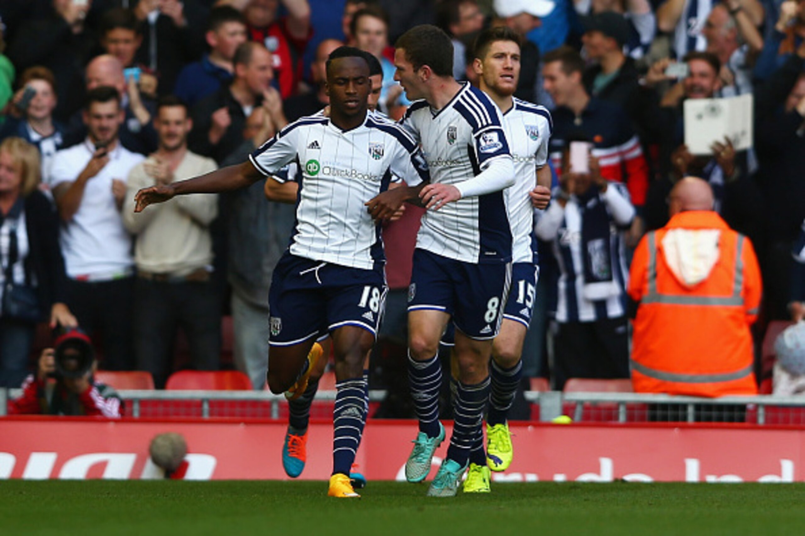 LIVERPOOL, ENGLAND - OCTOBER 04:  Saido Berahino of West Brom celebrates scoring their first goal with Craig Gardner of West Brom during the Barclays Premier League match between Liverpool and West Bromwich Albion at Anfield on October 4, 2014 in Liverpoo
