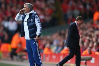 LIVERPOOL, ENGLAND - APRIL 27:  Jose Mourinho manager of Chelsea gives his team instructions as Liverpool manager Brendan Rodgers walks away showing his dejectioin during the Barclays Premier League match between Liverpool and Chelsea at Anfield on April 