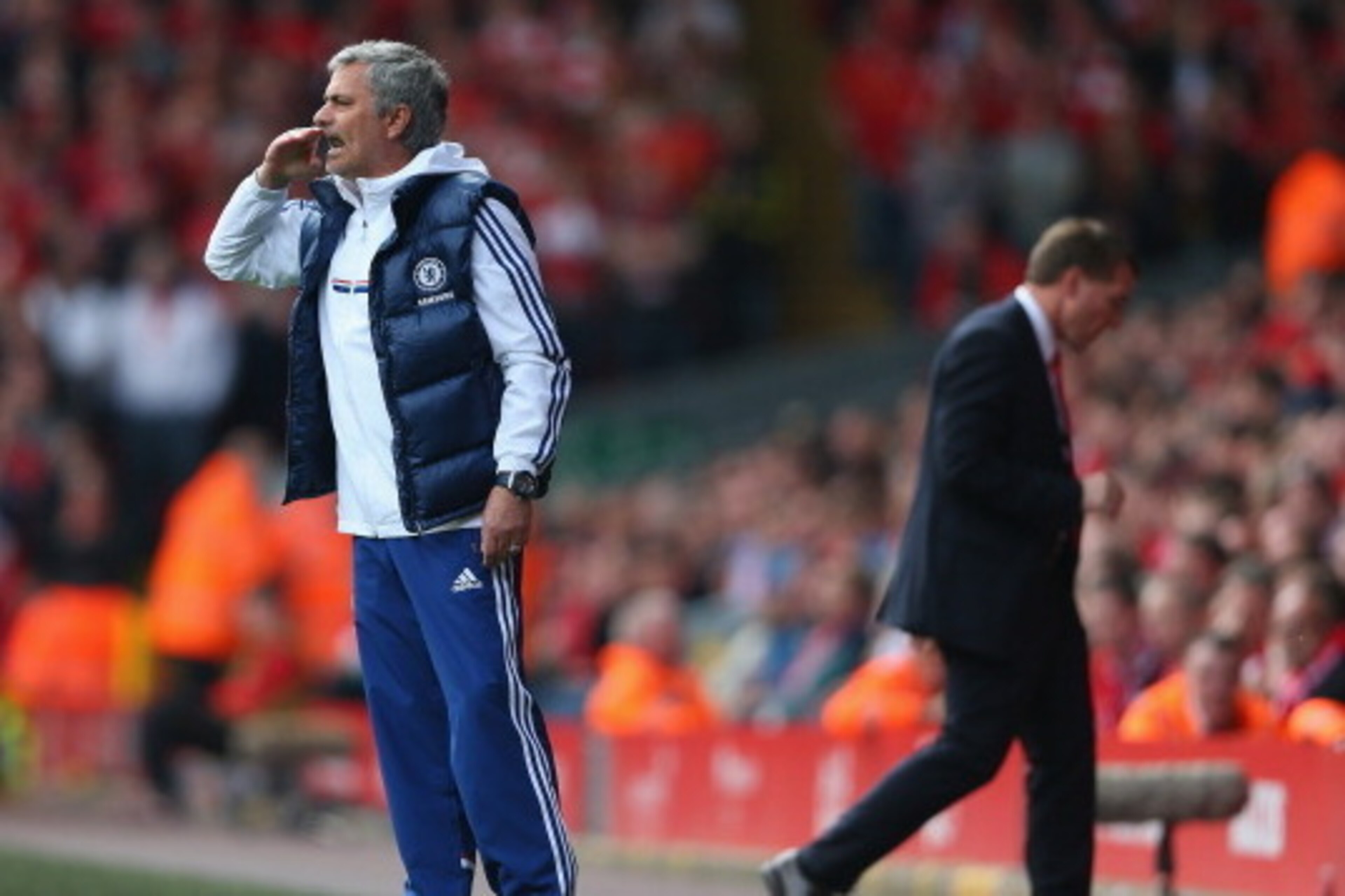 LIVERPOOL, ENGLAND - APRIL 27:  Jose Mourinho manager of Chelsea gives his team instructions as Liverpool manager Brendan Rodgers walks away showing his dejectioin during the Barclays Premier League match between Liverpool and Chelsea at Anfield on April 