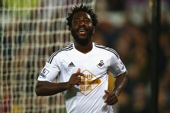 SWANSEA, WALES - OCTOBER 25:  Wilfried Bony of Swansea City celebrates scoring their second goal during the Barclays Premier League match between Swansea City and Leicester City at Liberty Stadium on October 25, 2014 in Swansea, Wales.  (Photo by Clive Ro