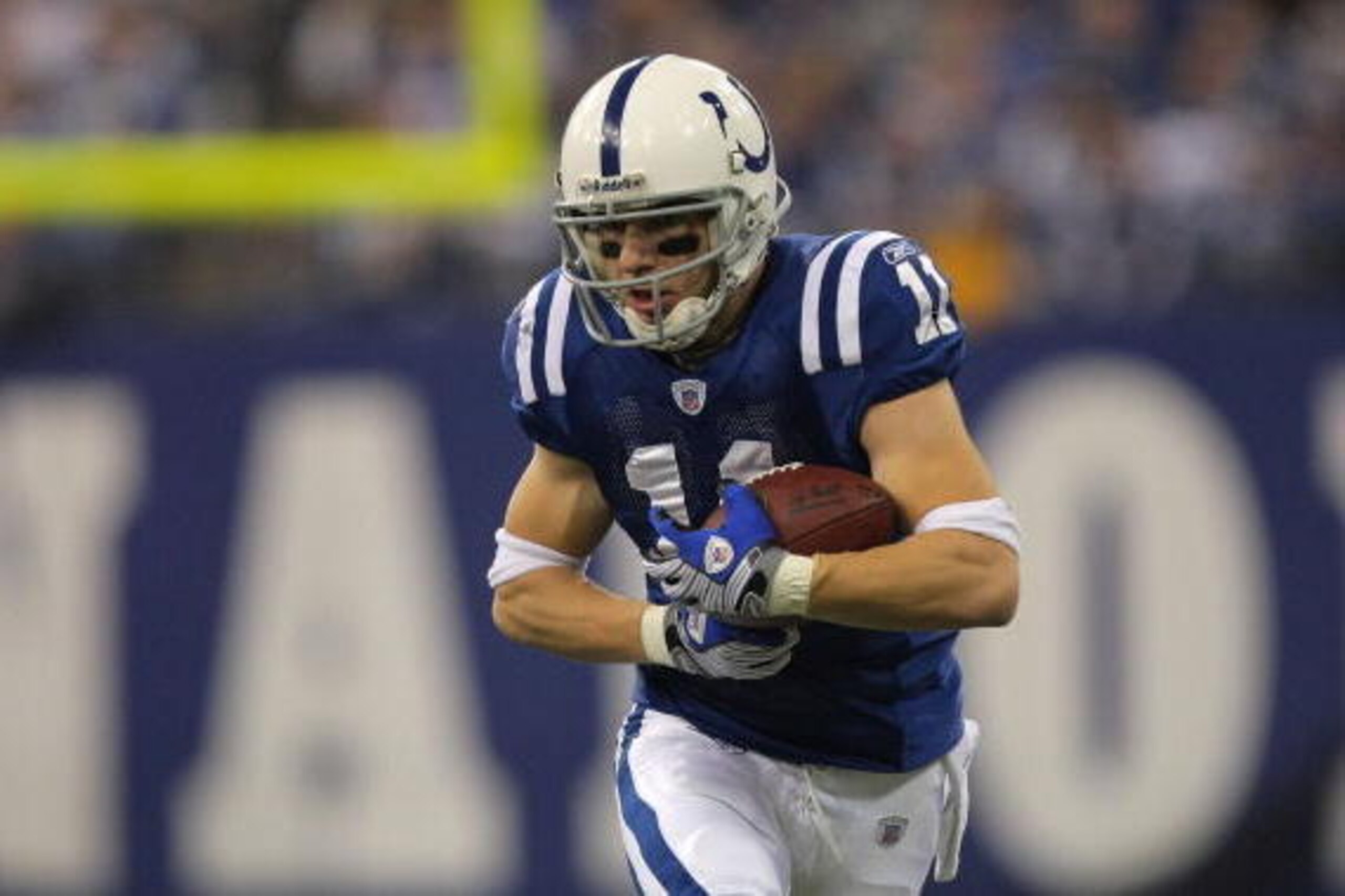 INDIANAPOLIS - JANUARY 13:  Anthony Gonzalez #11 of the Indianapolis Colts runs for yards after the catch against the San Diego Chargers during their AFC Divisional Playoff game at the RCA Dome on January 13, 2008 in Indianapolis, Indiana. The Chargers wo