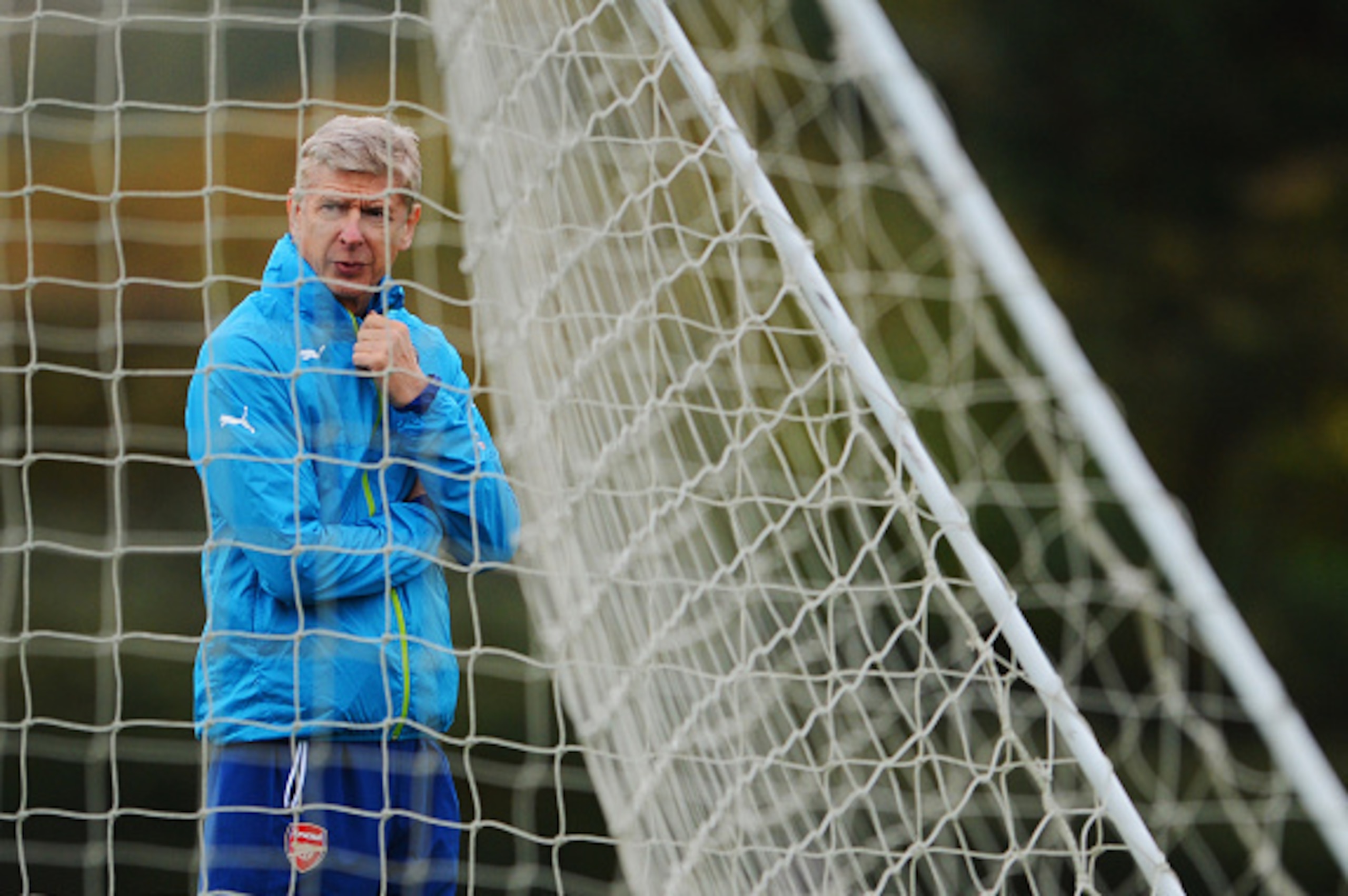 ST ALBANS, ENGLAND - NOVEMBER 03:  Arsene Wenger manager of Arsenal looks on during an Arsenal training session ahead of the UEFA Champions League match against RSC Anderlecht at London Colney on November 3, 2014 in St Albans, England.  (Photo by Michael 