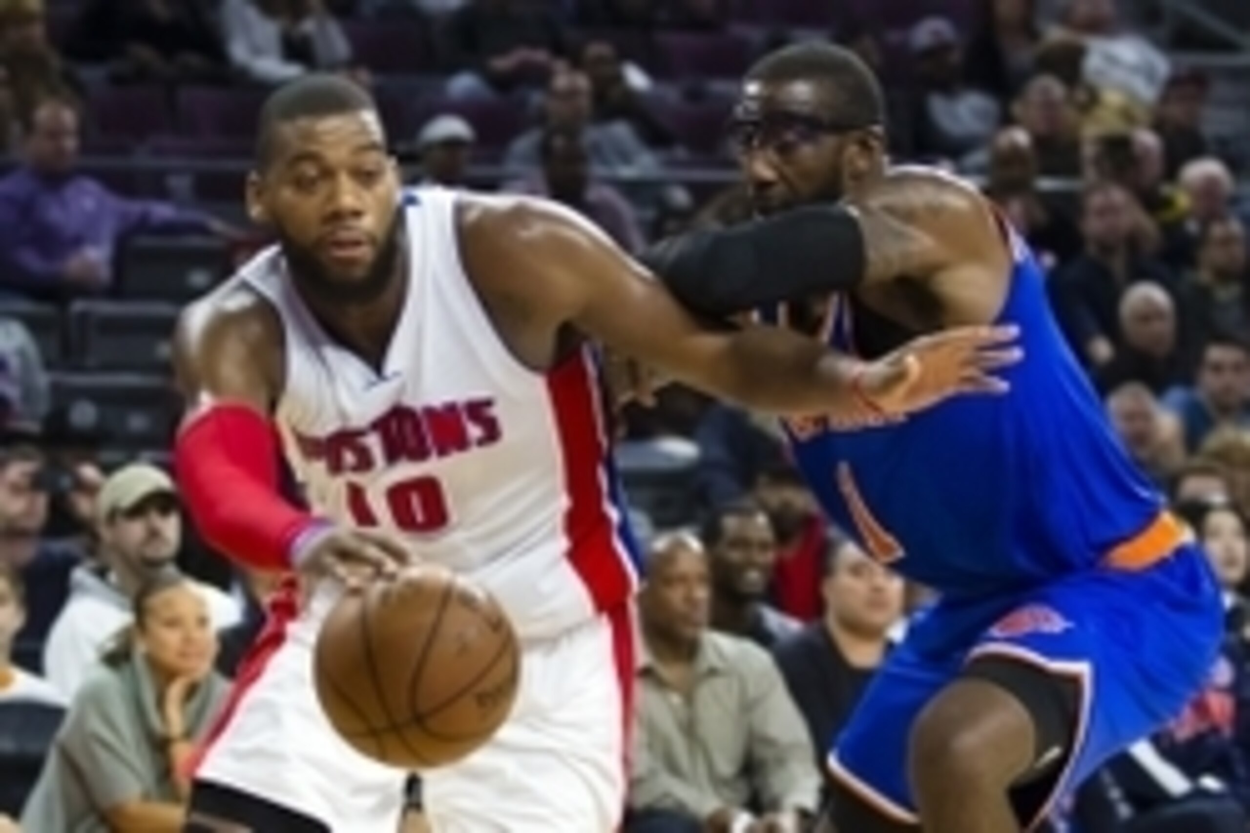 Nov 5, 2014; Auburn Hills, MI, USA; Detroit Pistons forward Greg Monroe (10) is defended by New York Knicks forward Amar'e Stoudemire (1) in the fourth quarter at The Palace of Auburn Hills. Detroit won 98-95. Mandatory Credit: Rick Osentoski-USA TODAY Sp