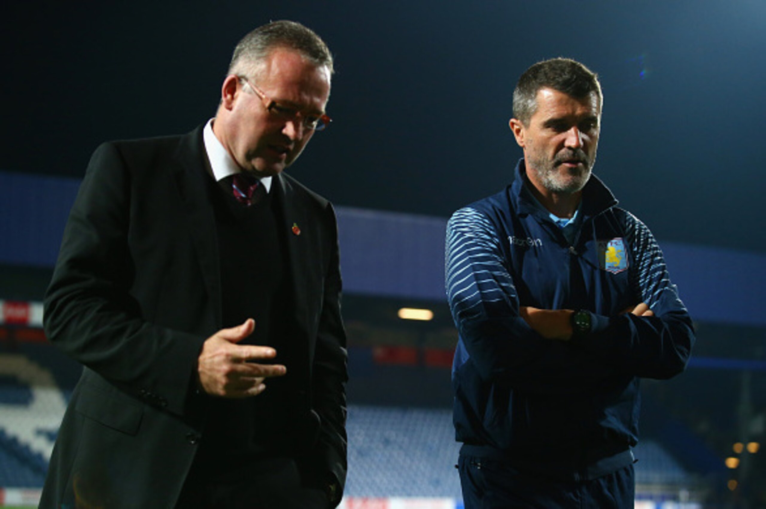 LONDON, ENGLAND - OCTOBER 27:  Manager Paul Lambert of Aston Villa and  Roy Keane, Aston Villa assistant manager walk on the pitch prior to the Barclays Premier League match between Queens Park Rangers and Aston Villa at Loftus Road on October 27, 2014 in