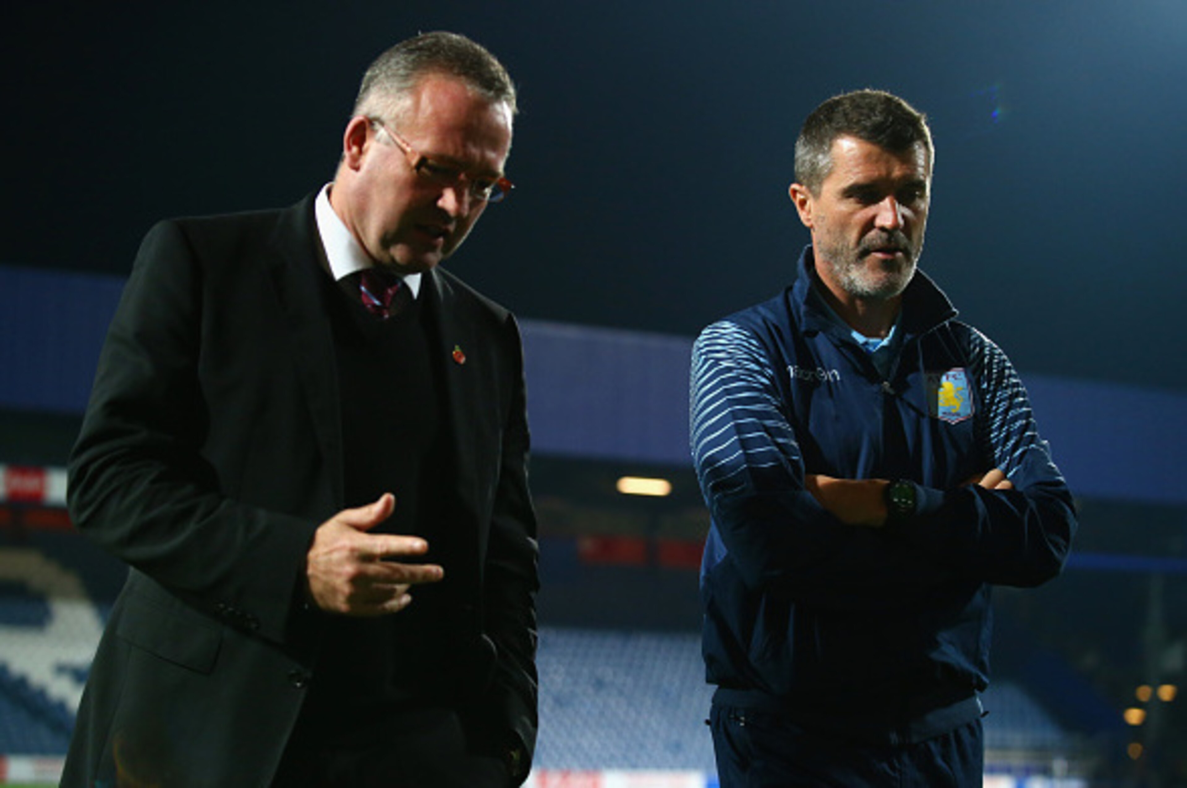 LONDON, ENGLAND - OCTOBER 27:  Manager Paul Lambert of Aston Villa and  Roy Keane, Aston Villa assistant manager walk on the pitch prior to the Barclays Premier League match between Queens Park Rangers and Aston Villa at Loftus Road on October 27, 2014 in
