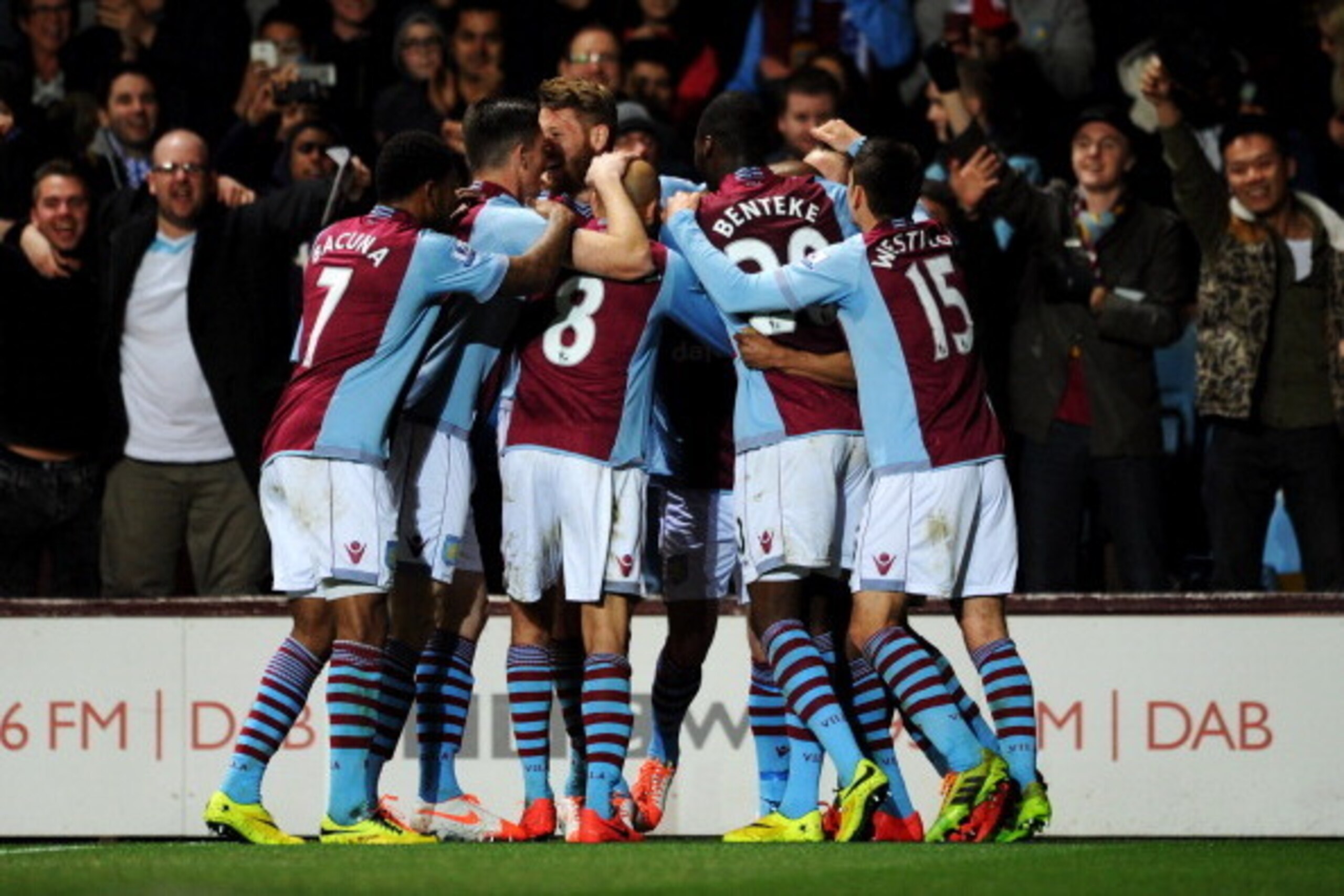 BIRMINGHAM, ENGLAND - MARCH 15:  Fabian Delph of Aston Villa (obscured) is congratulated by team mates as he scores their first goal during the Barclays Premier League match between Aston Villa and Chelsea at Villa Park on March 15, 2014 in Birmingham, En