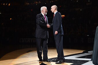 SAN ANTONIO, TX - OCTOBER 28: Spurs head coach shakes hands with NBA Commissioner Adam Silver during the opening ceremony on October 28, 2014 at the AT&T Center in San Antonio,Texas. NOTE TO USER: User expressly acknowledges and agrees that, by downloadin