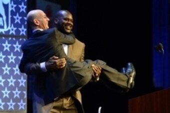 Feb 16, 2014; New Orleans, LA, USA; NBA legend Shaquille O'Neal picks up NBA commissioner Adam Silver as O'Neal is honored as the Legend of the Year during the 2014 NBA All-Star Game Legend Brunch at Ernest N. Morial Convention Center. Mandatory Credit: B