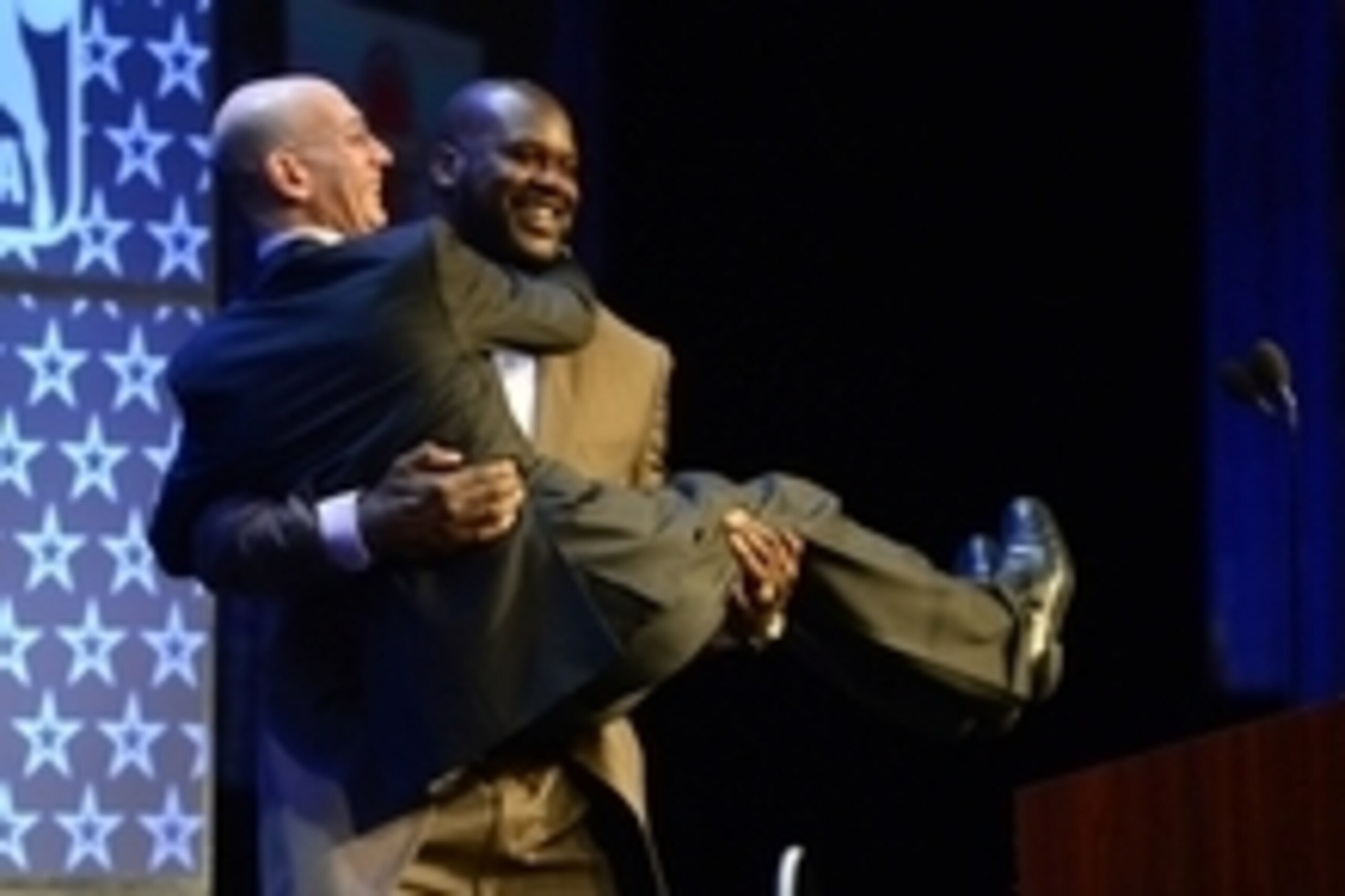 Feb 16, 2014; New Orleans, LA, USA; NBA legend Shaquille O'Neal picks up NBA commissioner Adam Silver as O'Neal is honored as the Legend of the Year during the 2014 NBA All-Star Game Legend Brunch at Ernest N. Morial Convention Center. Mandatory Credit: B