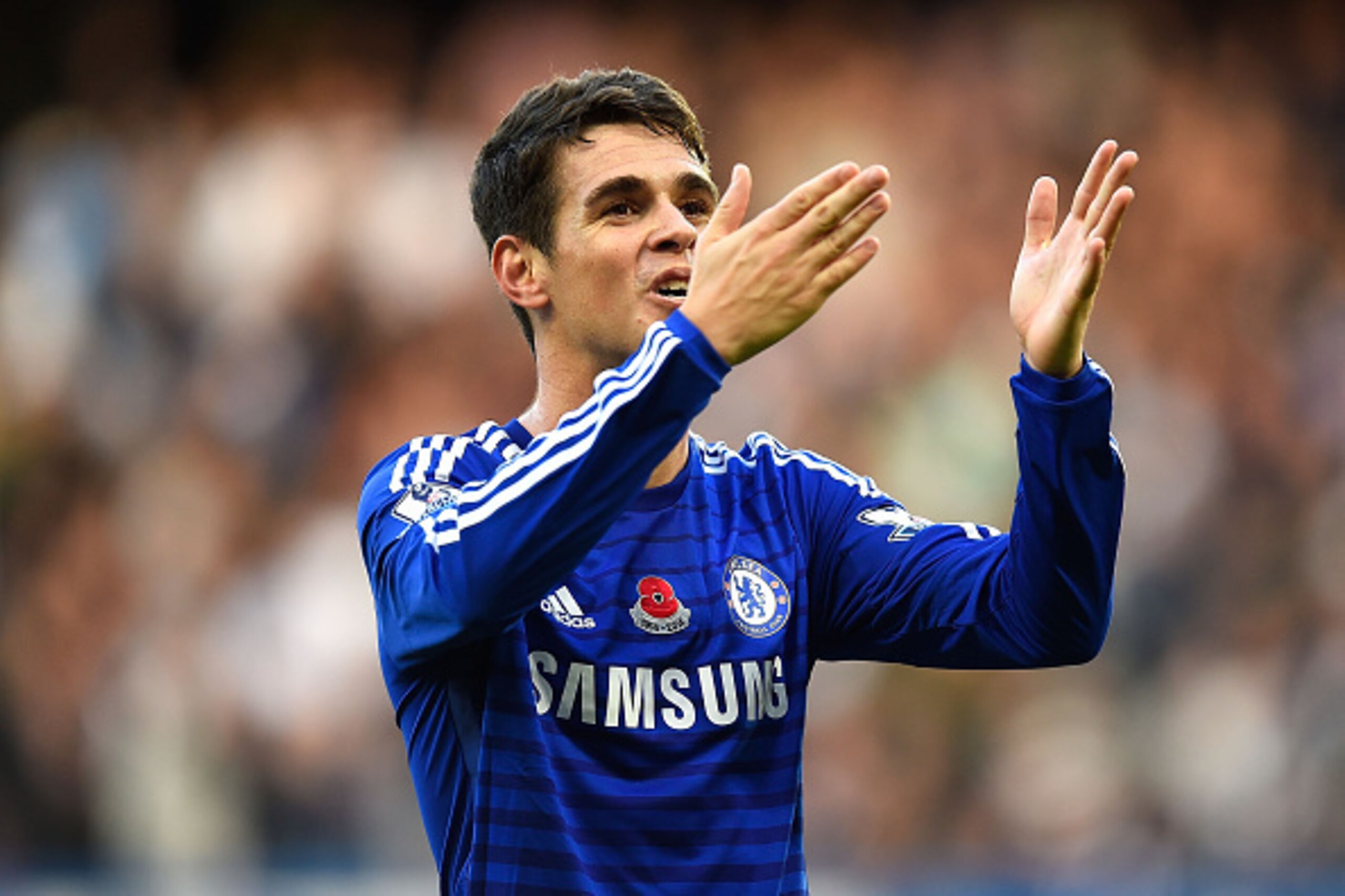 LONDON, ENGLAND - NOVEMBER 01:  Oscar of Chelsea celebrates scoring the opening goal during the Barclays Premier League match between Chelsea and Queens Park Rangers at Stamford Bridge on November 1, 2014 in London, England.  (Photo by Mike Hewitt/Getty I