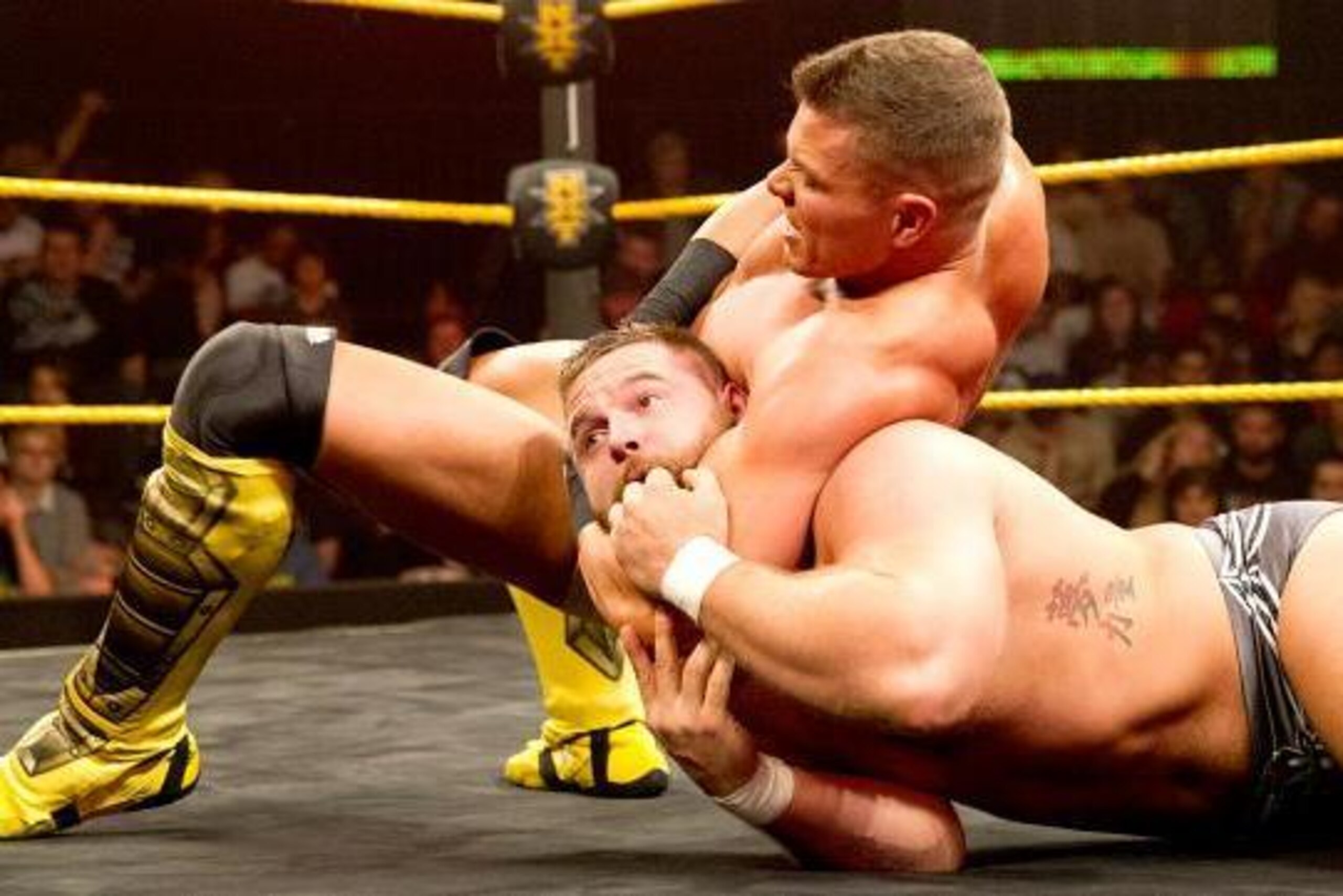 Tyson Kidd in control of Dash Wilder.