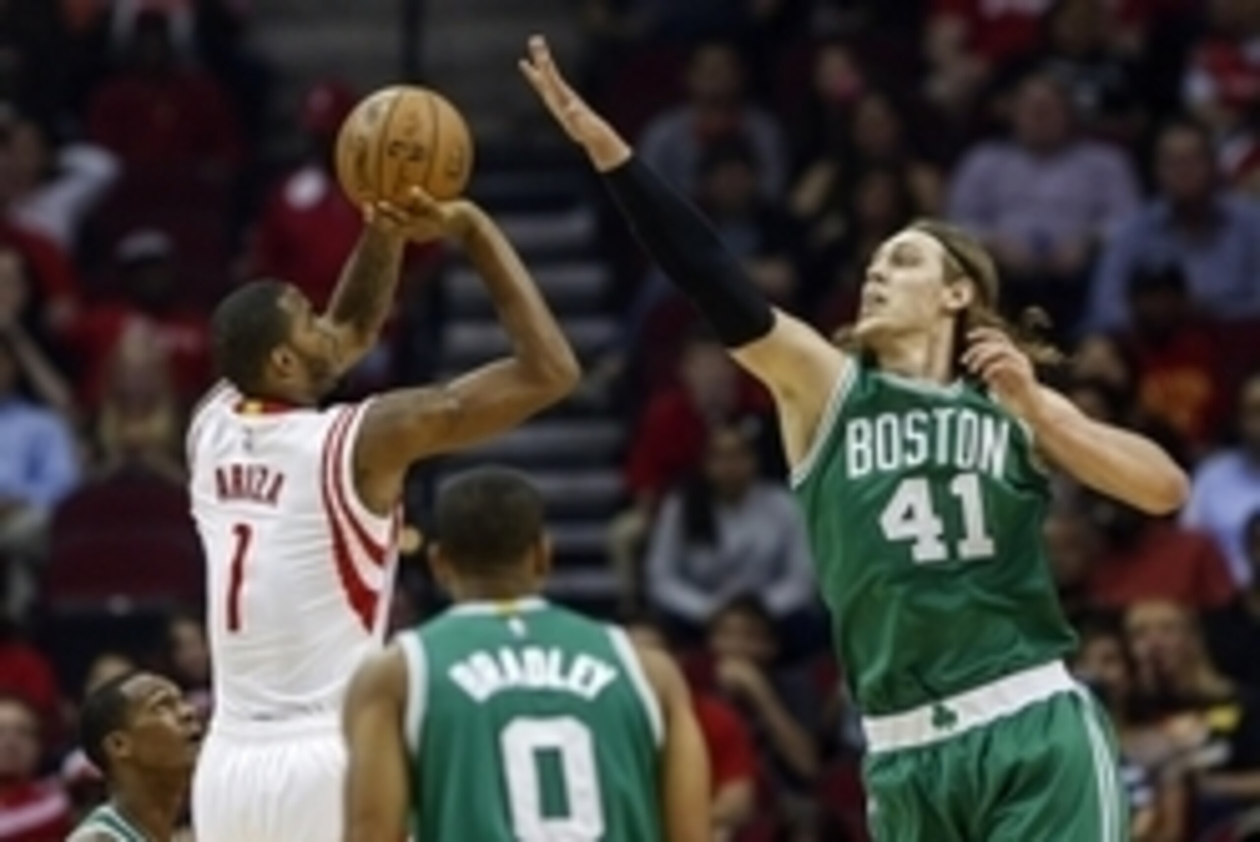 Nov 1, 2014; Houston, TX, USA; Houston Rockets guard Trevor Ariza (1) shoots during the first quarter as Boston Celtics center Kelly Olynyk (41) defends at Toyota Center. Mandatory Credit: Troy Taormina-USA TODAY Sports