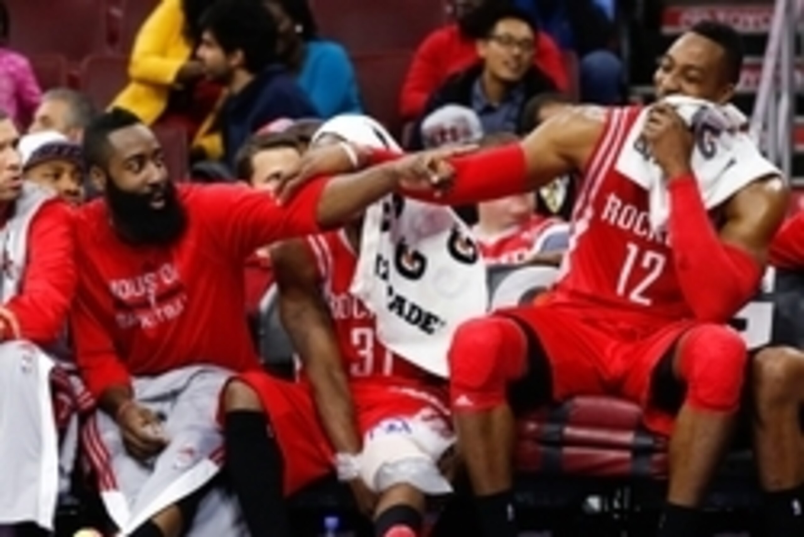 Nov 3, 2014; Philadelphia, PA, USA; Houston Rockets guard James Harden (left) and center Dwight Howard (12) joke around on the bench as time winds down in a game against the Philadelphia 76ers at the Wells Fargo Center. The Rockets defeated the 76ers 104-
