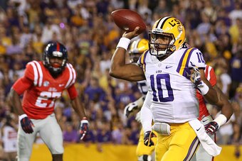 BATON ROUGE, LA - OCTOBER 25:  Anthony Jennings #10 of the LSU Tigers throws a pass against the Mississippi Rebels at Tiger Stadium on October 25, 2014 in Baton Rouge, Louisiana.  (Photo by Chris Graythen/Getty Images)