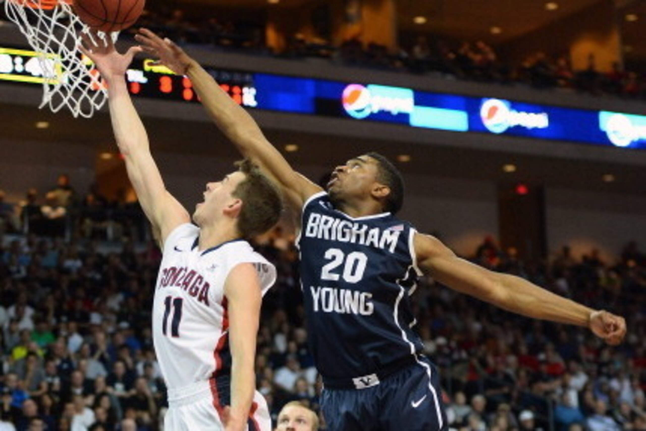 LAS VEGAS, NV - MARCH 11:  David Stockton #11 of the Gonzaga Bulldogs drives to the basket against Anson Winder #20 of the Brigham Young Cougars during the championship game of the West Coast Conference Basketball tournament at the Orleans Arena on March 