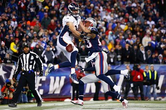 FOXBORO, MA - NOVEMBER 02:  Jacob Tamme #84 of the Denver Broncos drops a pass as Patrick Chung #23 of the New England Patriots defends during the fourth quarter at Gillette Stadium on November 2, 2014 in Foxboro, Massachusetts.  (Photo by Jared Wickerham