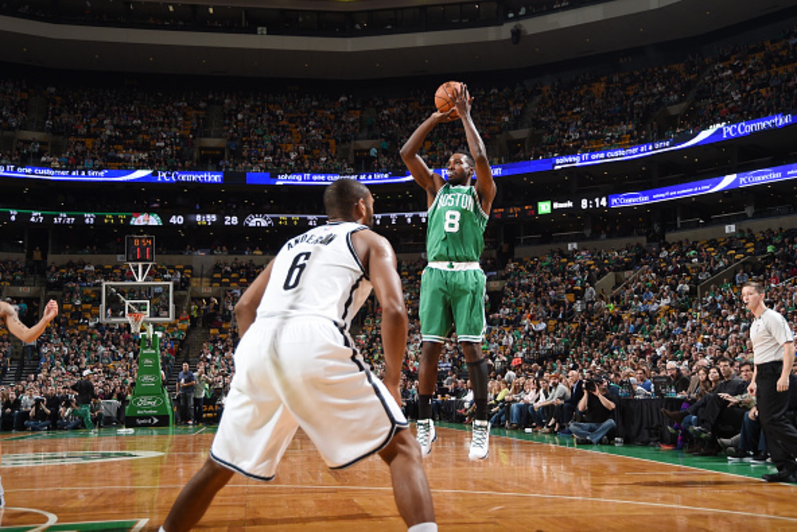 BOSTON, MA - OCTOBER 29: Jeff Green #8 of the Boston Celtics shoots against Alan Anderson #6 of the Brooklyn Nets during the game on October 29, 2014 at the TD Garden in Boston, Massachusetts. NOTE TO USER: User expressly acknowledges and agrees that, by 