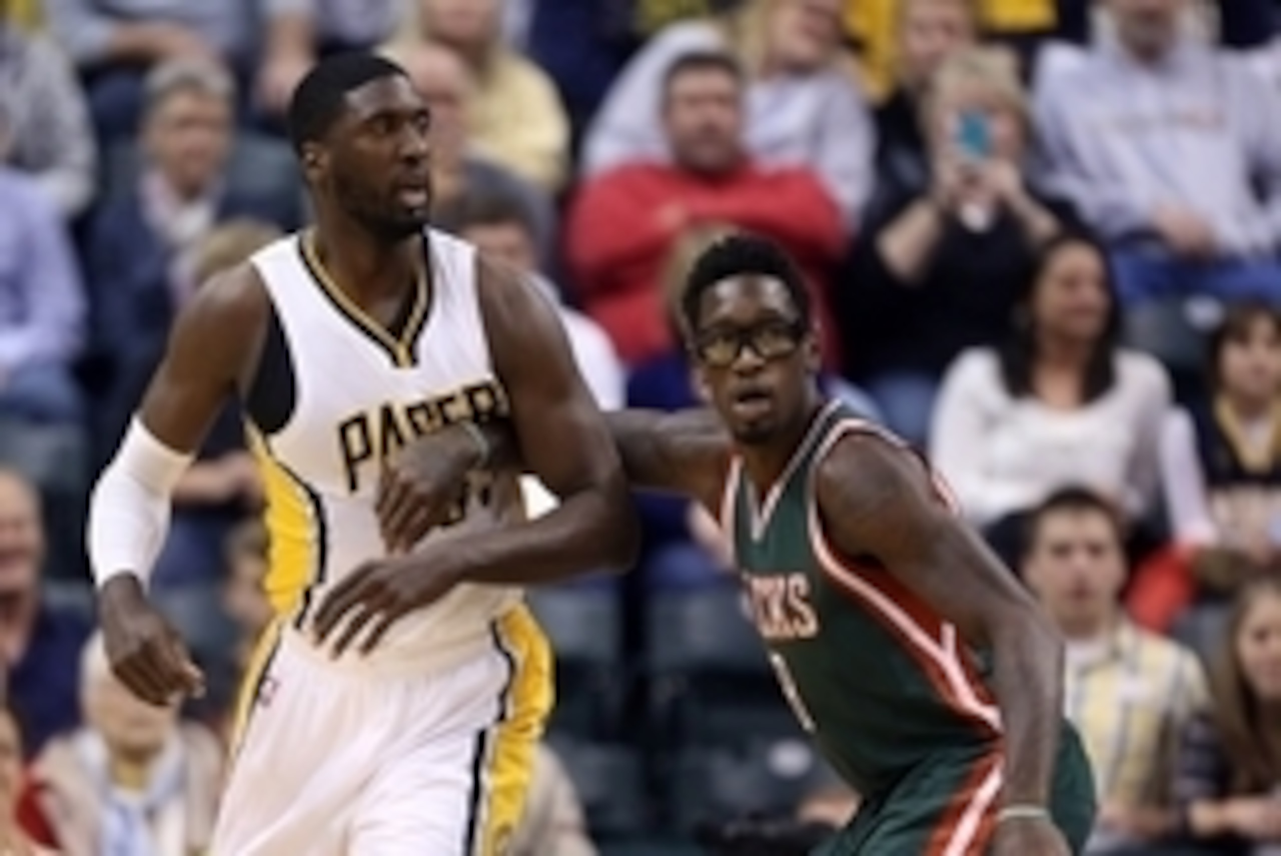 Nov 4, 2014; Indianapolis, IN, USA; Indiana Pacers center Roy Hibbert (55) posts up against Milwaukee Bucks center Larry Sanders (8) at Bankers Life Fieldhouse. Mandatory Credit: Brian Spurlock-USA TODAY Sports
