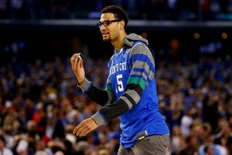 ARLINGTON, TX - APRIL 05:  Willie Cauley-Stein #15 of the Kentucky Wildcats walks on the court after defeating the Wisconsin Badgers 74-73 in the NCAA Men's Final Four Semifinal at AT&T Stadium on April 5, 2014 in Arlington, Texas.  (Photo by Tom Penningt