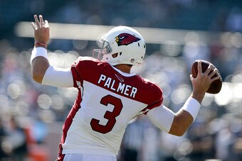 OAKLAND, CA - OCTOBER 19: Carson Palmer #3 of the Arizona Cardinals warms up at O.co Coliseum on October 19, 2014 in Oakland, California.  (Photo by Ezra Shaw/Getty Images)